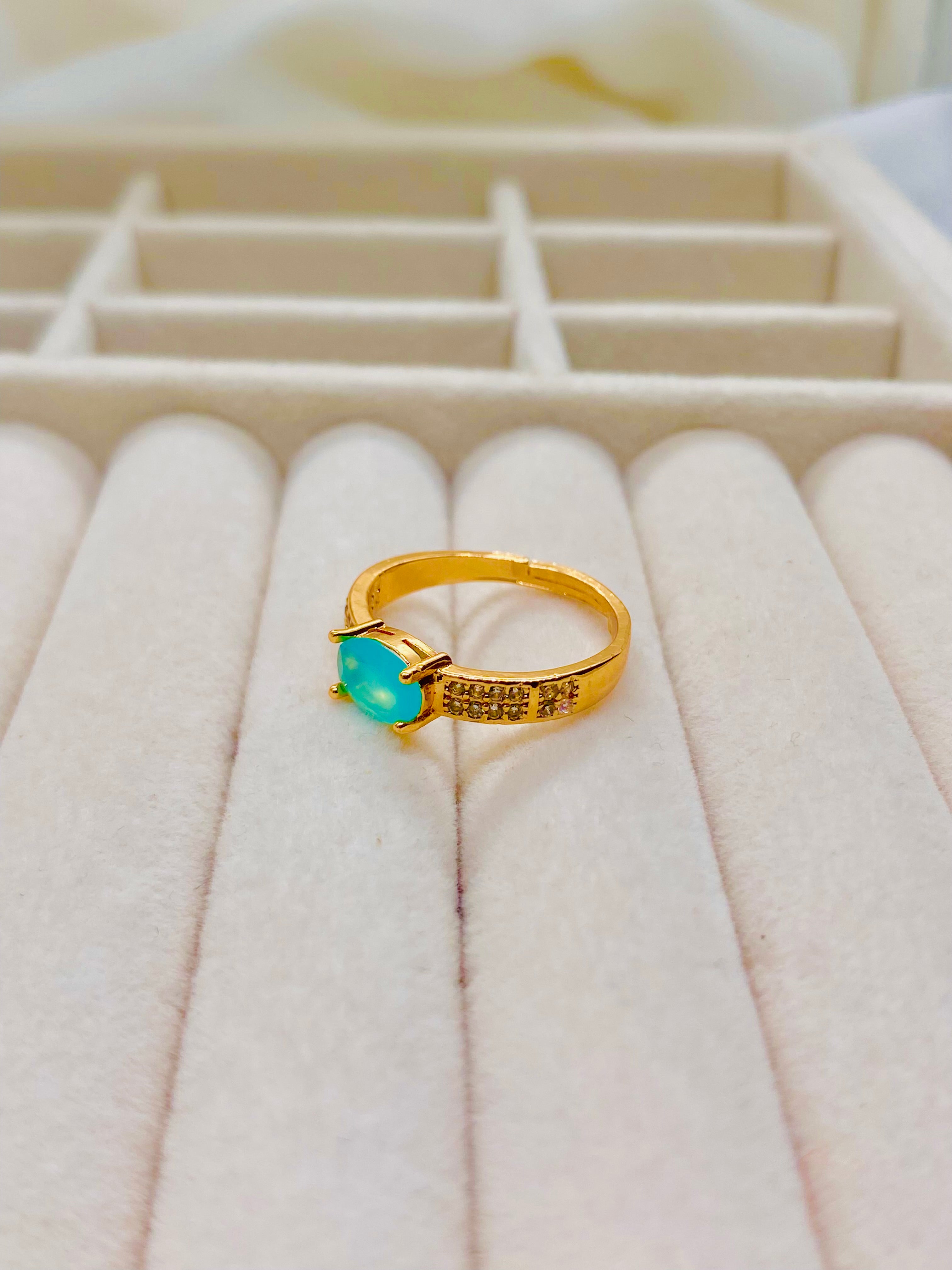 Classic Gold Solitaire Ring with Oval Turquoise Gemstone