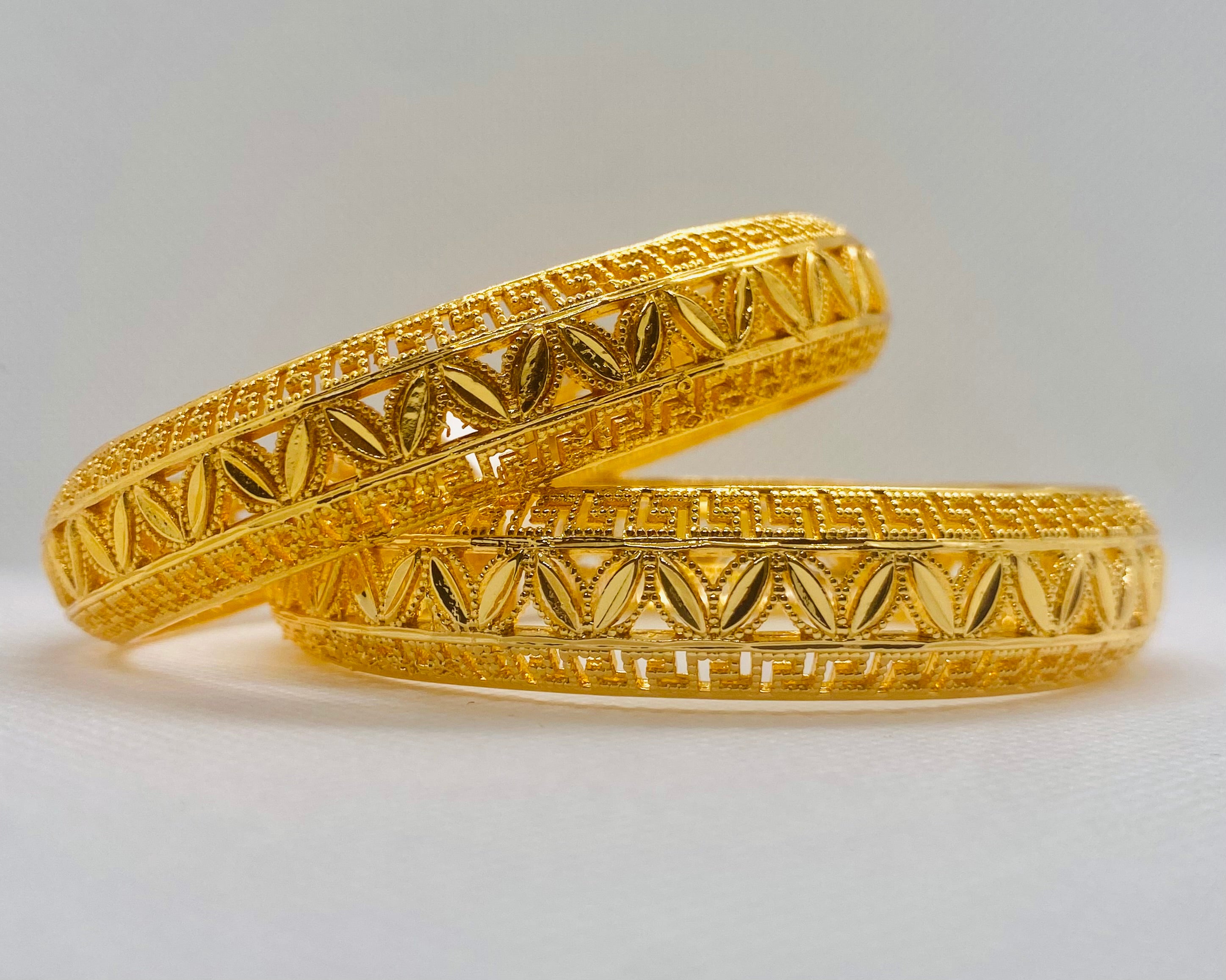 Exquisite Gold Bangles with Intricate Greek Key and Leaf Motif