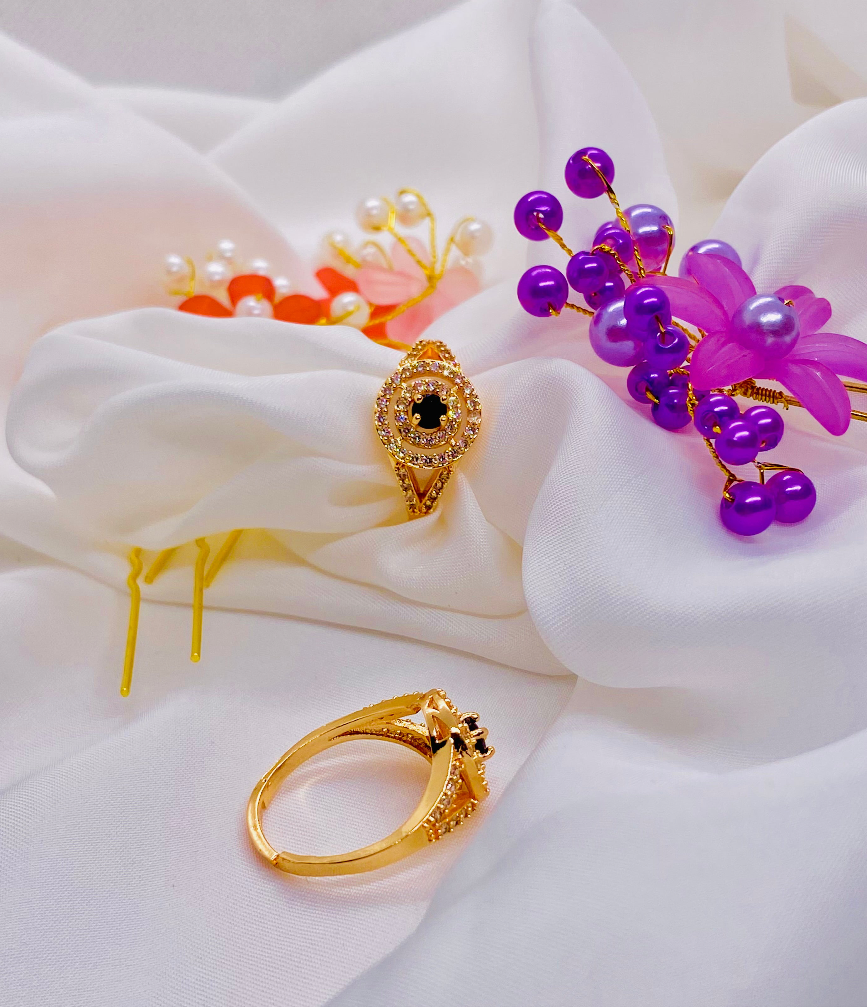 Elegant Gold Ring with Black Stone Centerpiece