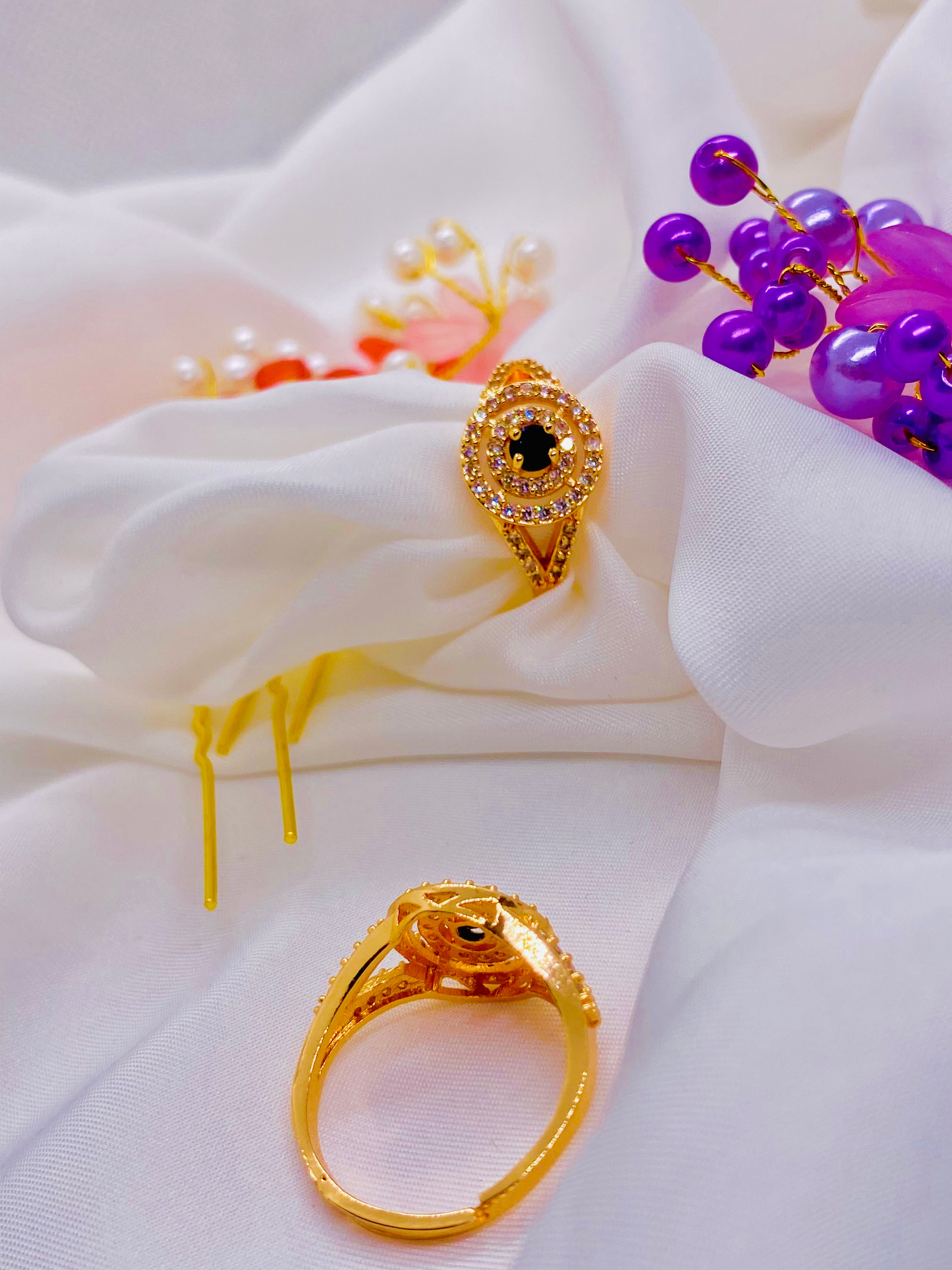 Elegant Gold Ring with Black Stone Centerpiece