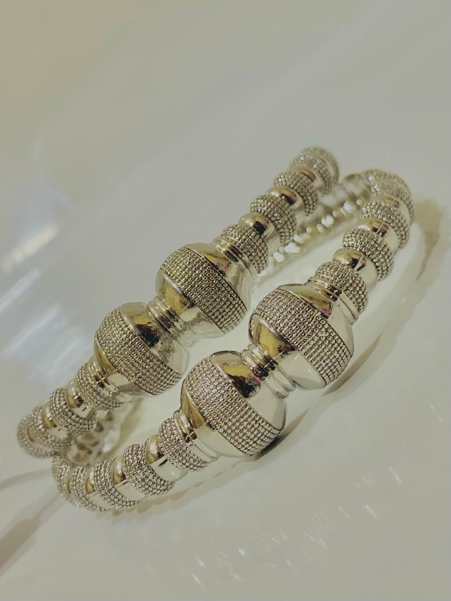 Intricately Designed Silver Bangles with Bead-Like Embellishments