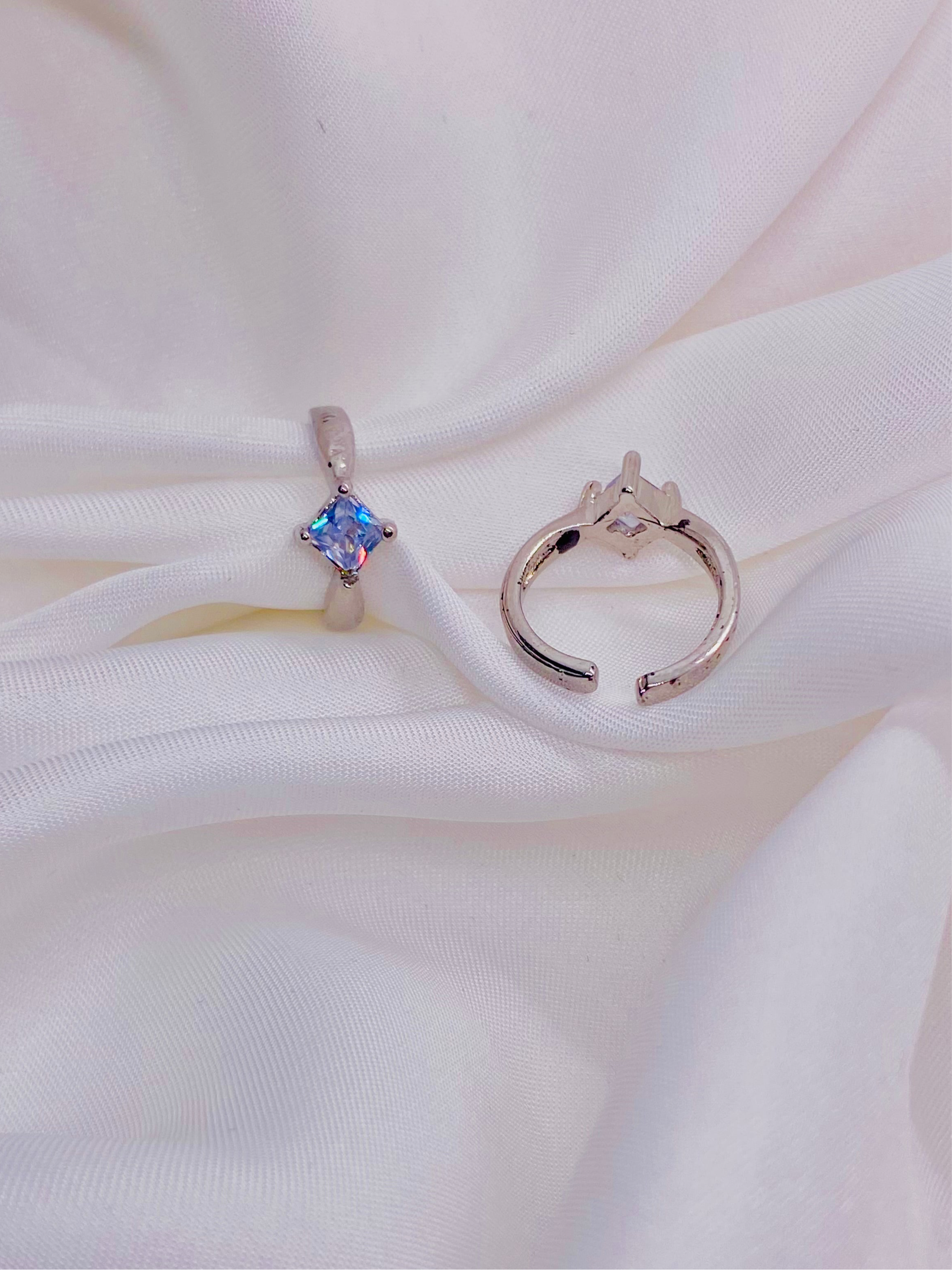 Elegant Dual-Tone Silver Adjustable Rings with Blue Center Stone