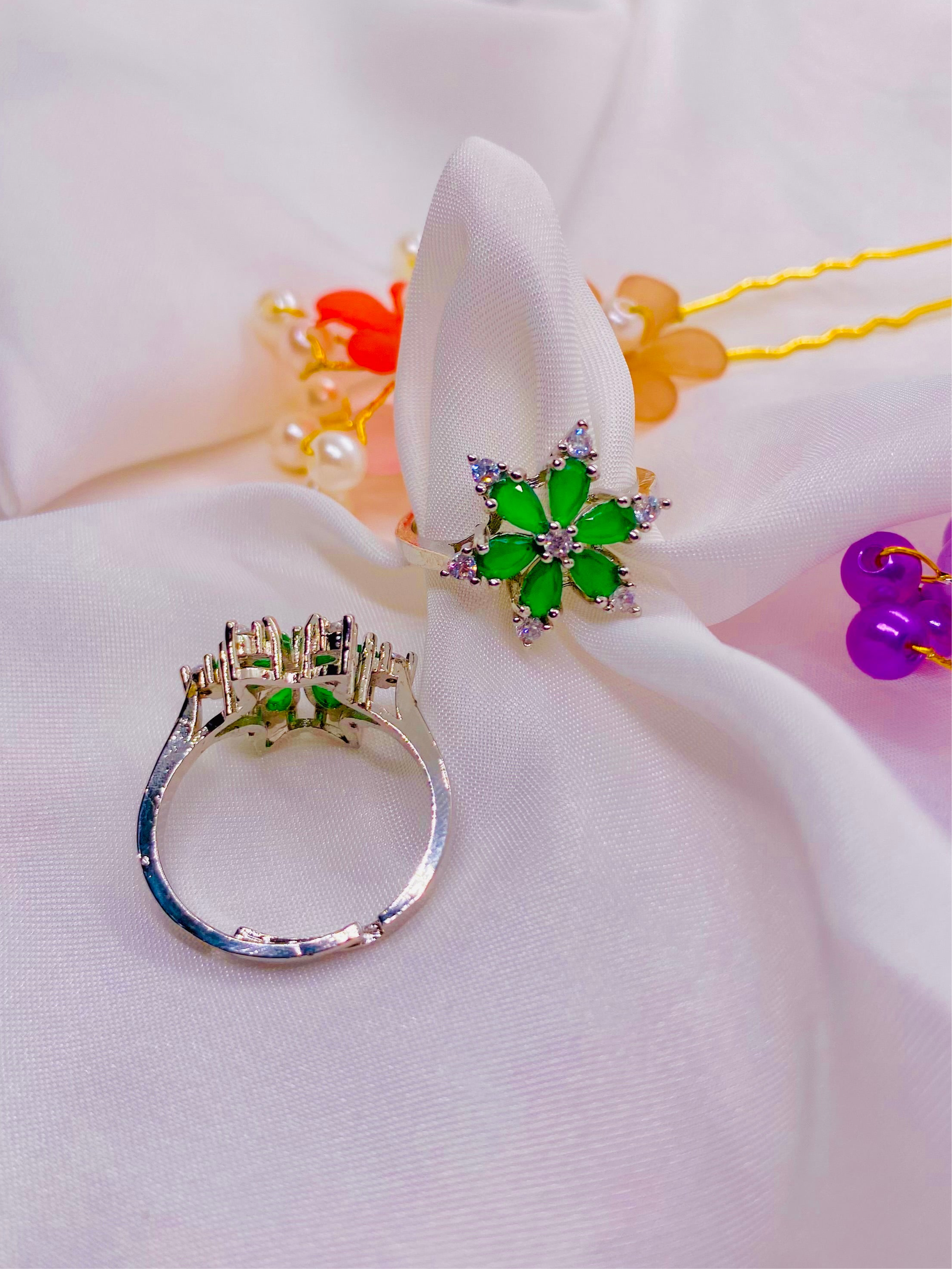 Dazzling Silver Floral Ring with Emerald Green Petals