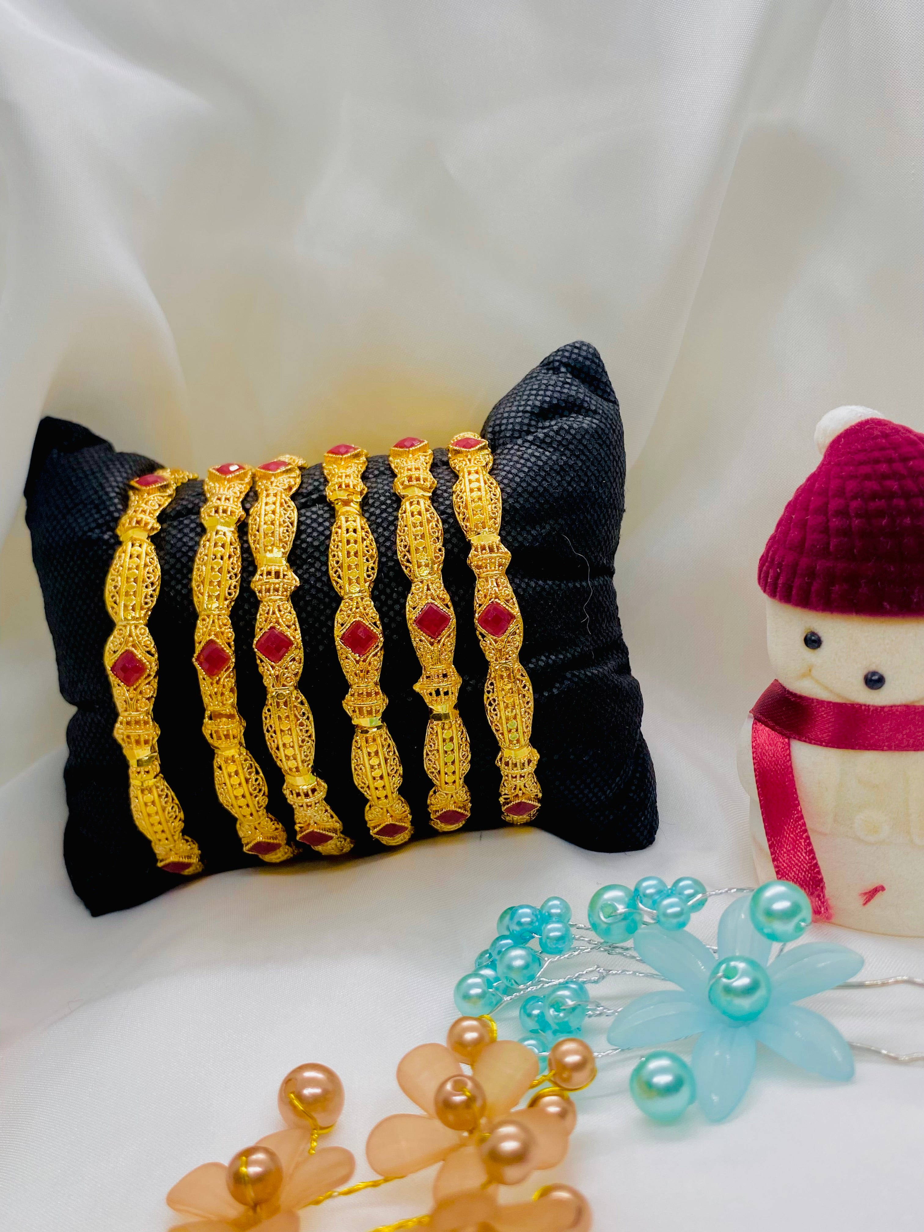 Classic Gold-Plated Bangles with Red Stone Accents – Set of Six
