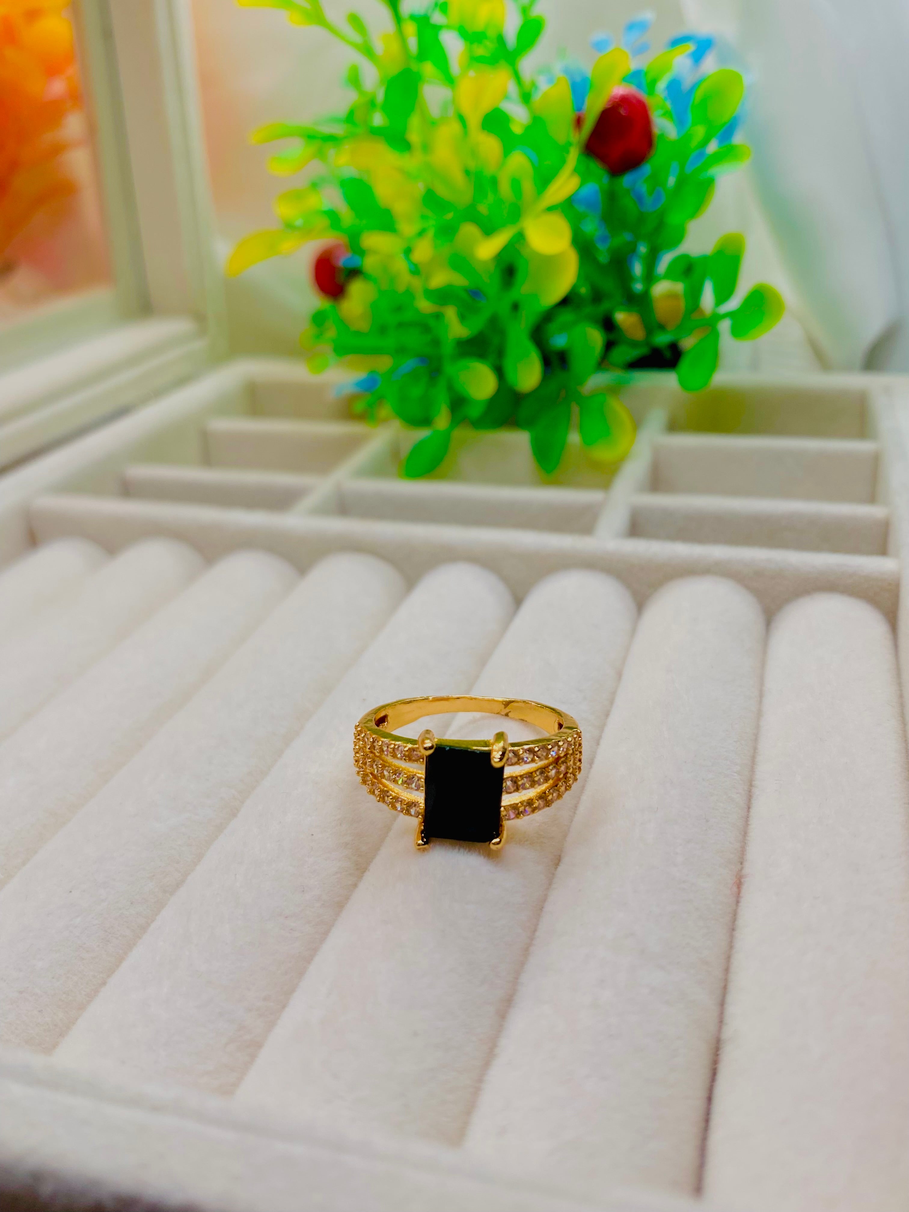 Elegant Gold-Plated Ring with Black Onyx Centerpiece