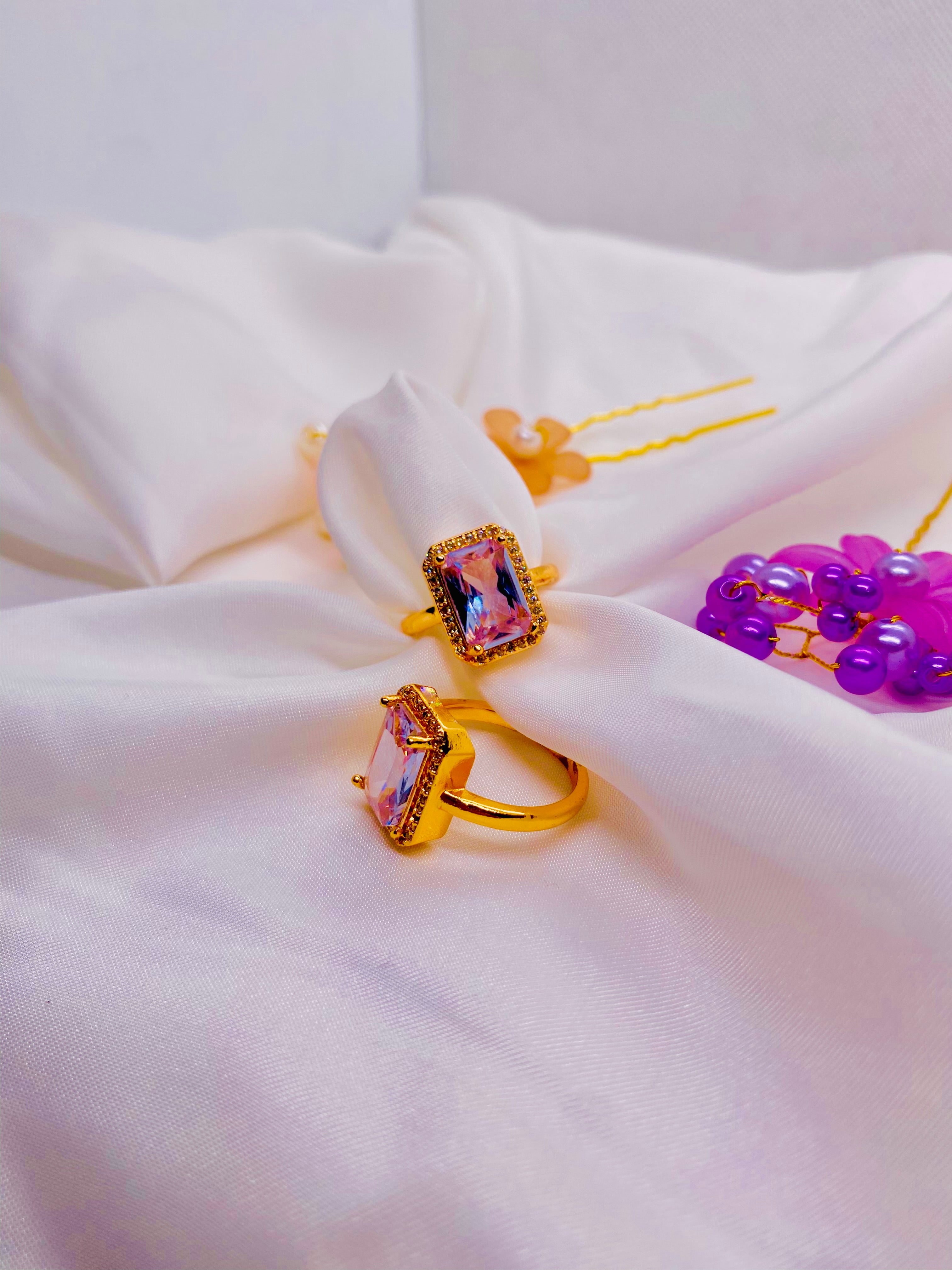 Elegant Golden Rings with Radiant Pink Gemstones