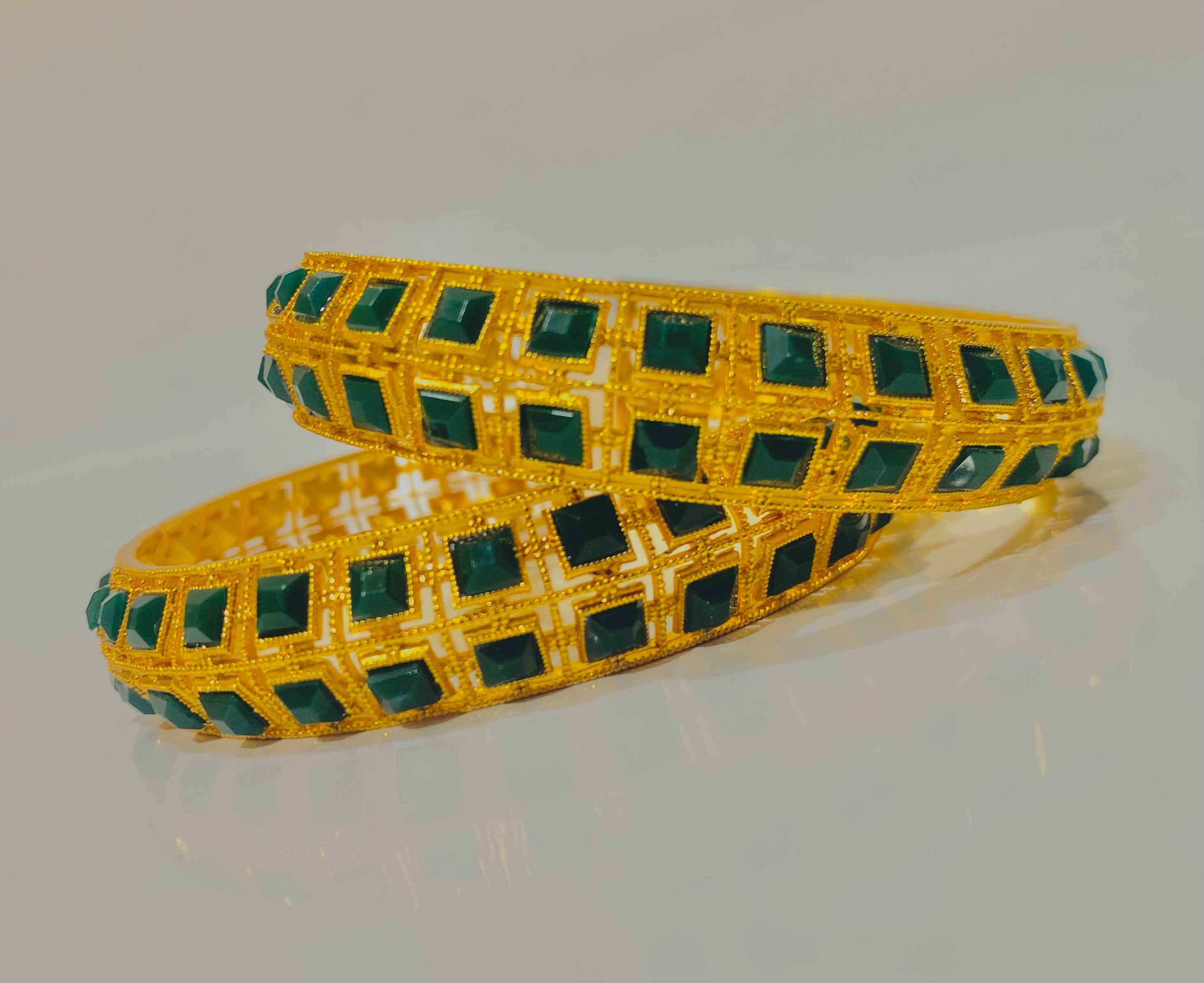 Elegant Gold-Plated Bangles with Emerald Green Stonework