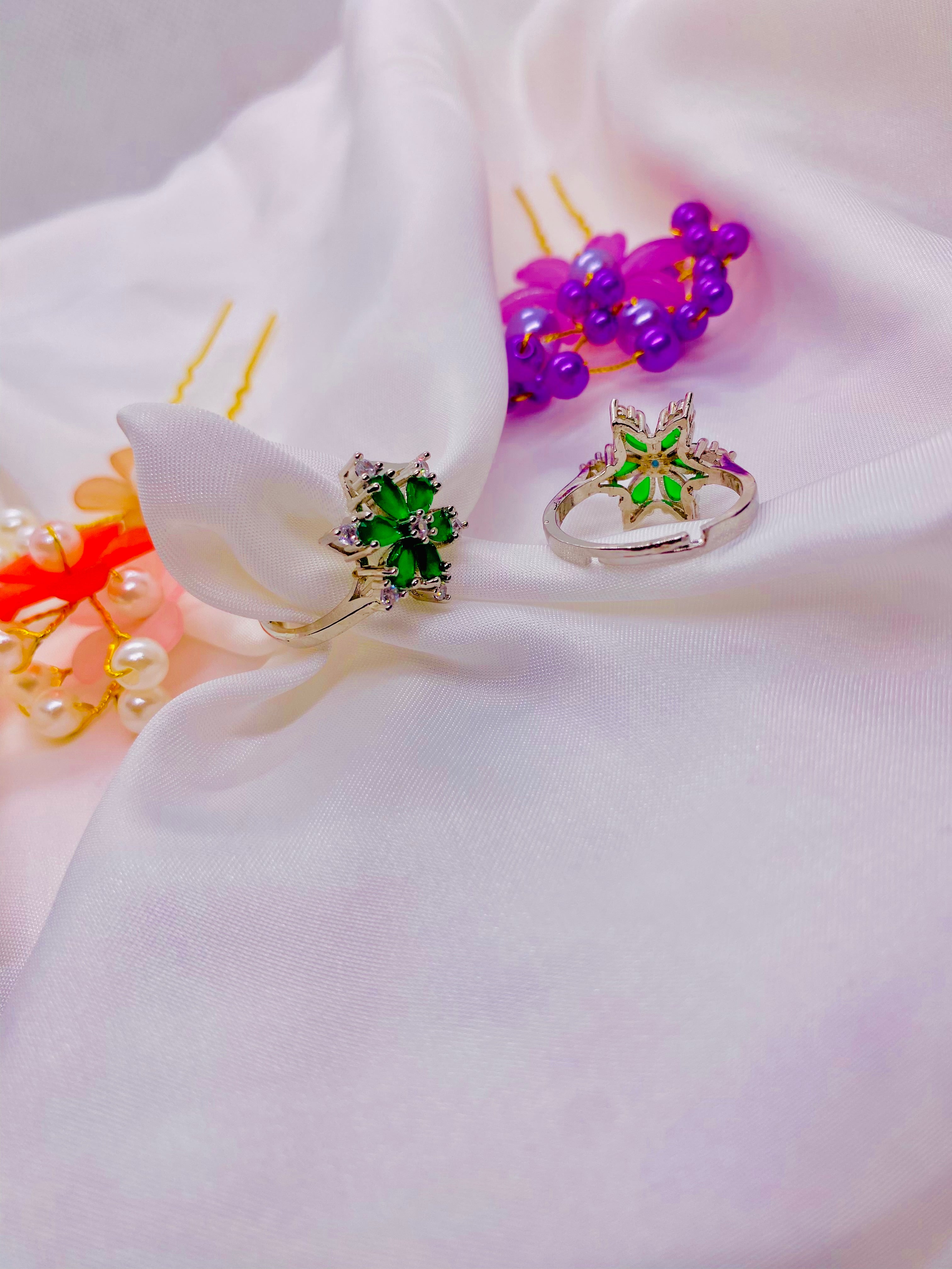 Dazzling Silver Floral Ring with Emerald Green Petals