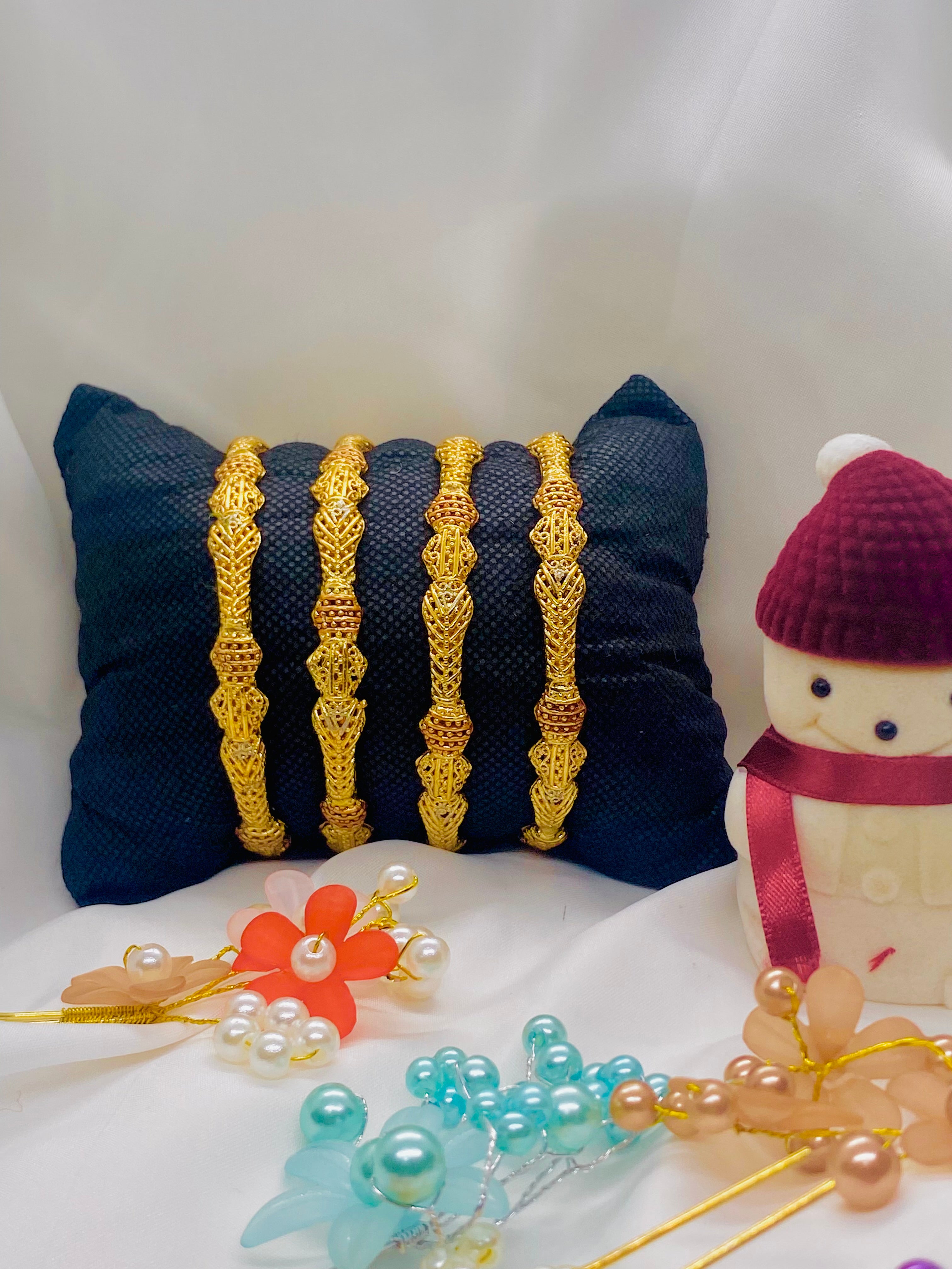Set of Four Antique-Finish Gold Bangles with Intricate Detailing