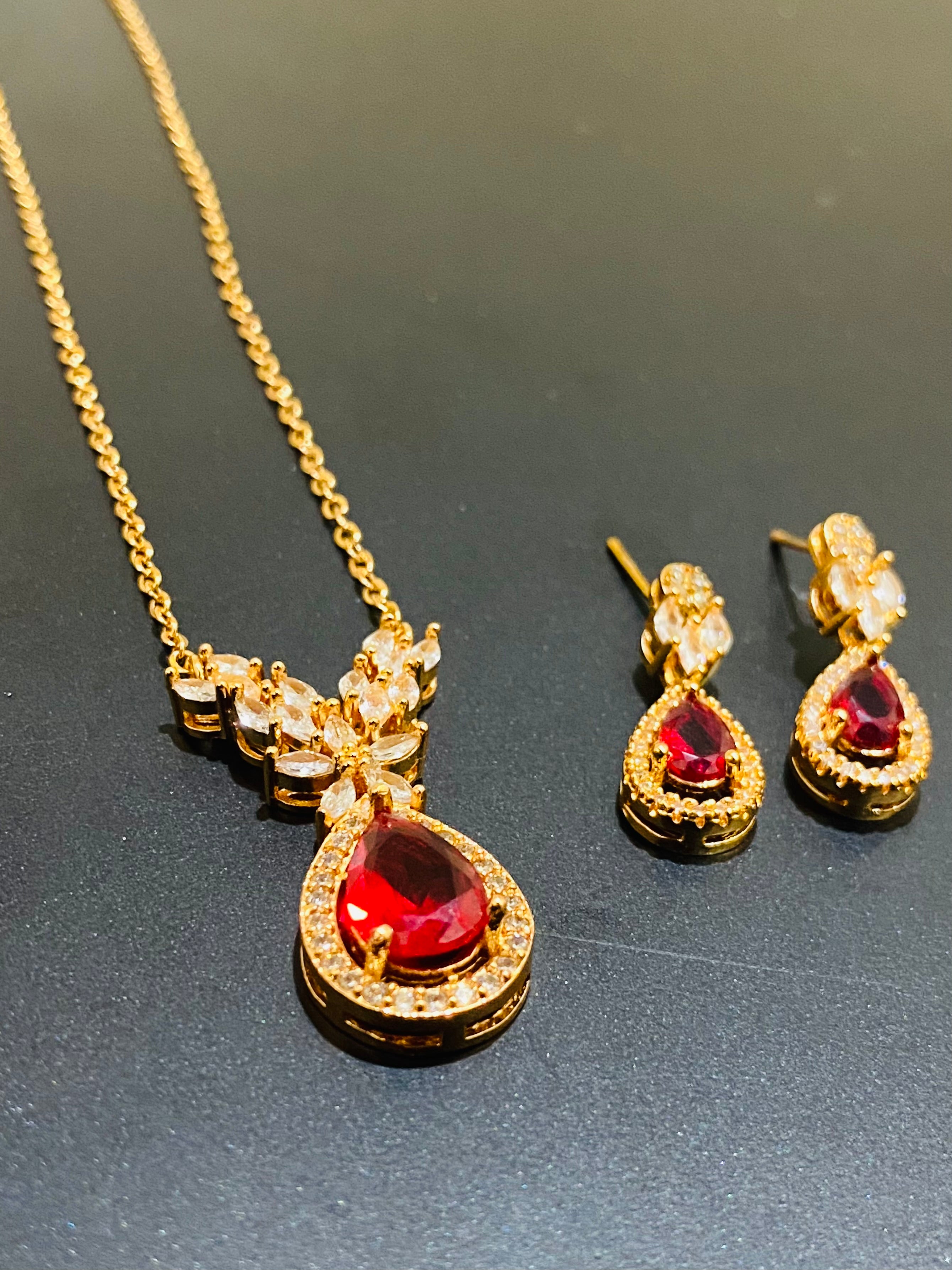 Elegant Gold-Plated Pendant Set with Ruby Red Stones