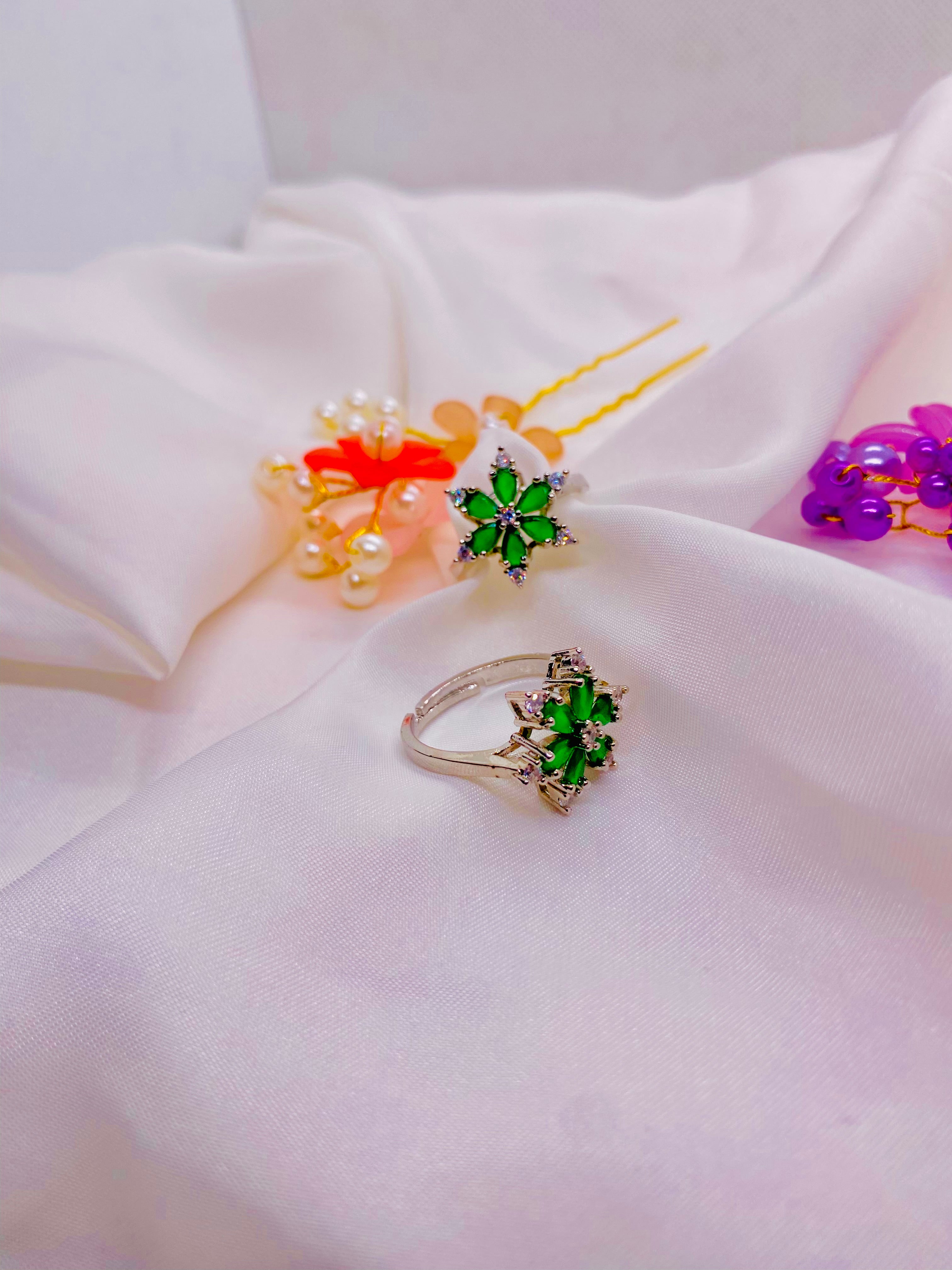 Dazzling Silver Floral Ring with Emerald Green Petals