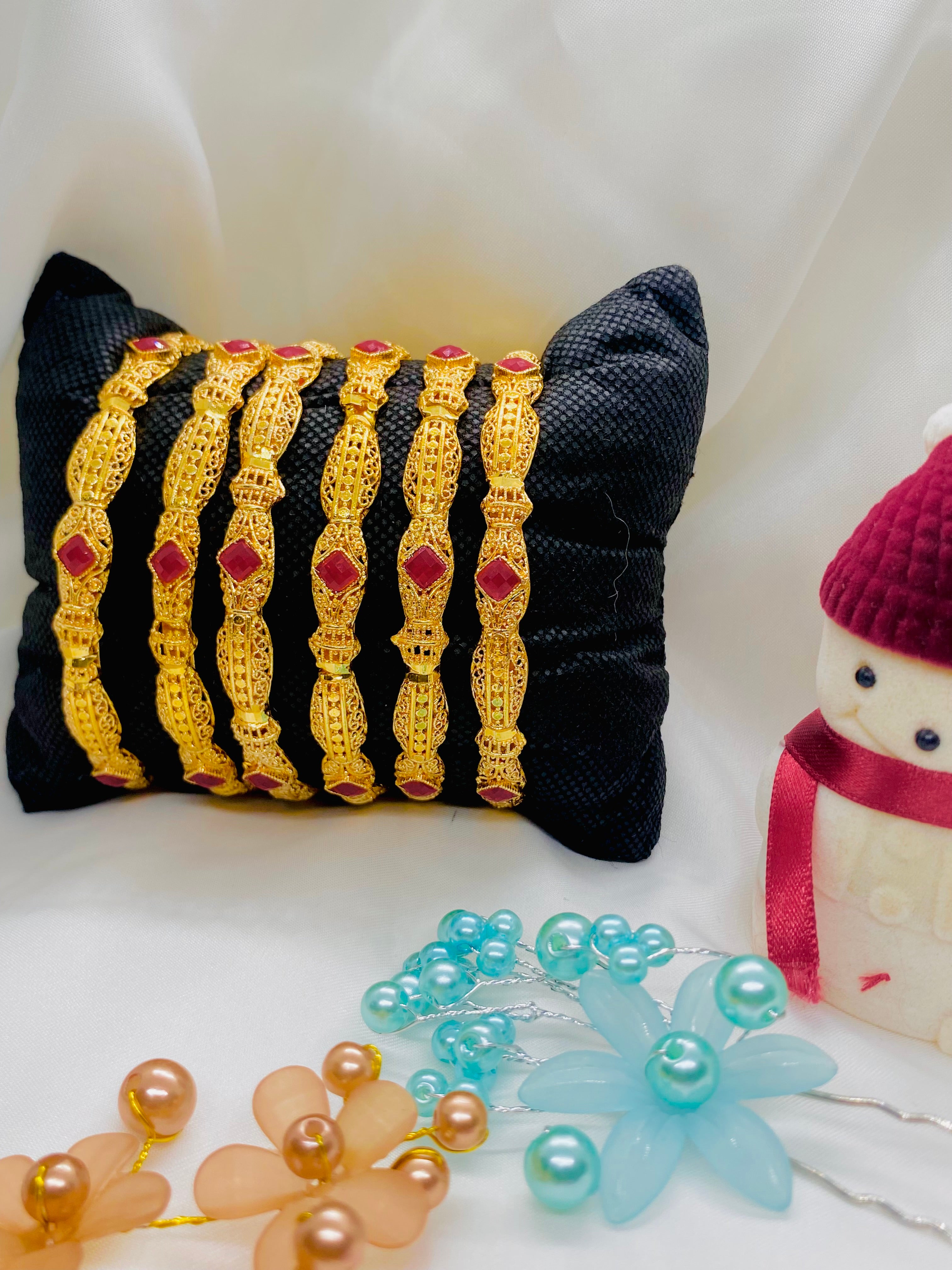 Classic Gold-Plated Bangles with Red Stone Accents – Set of Six