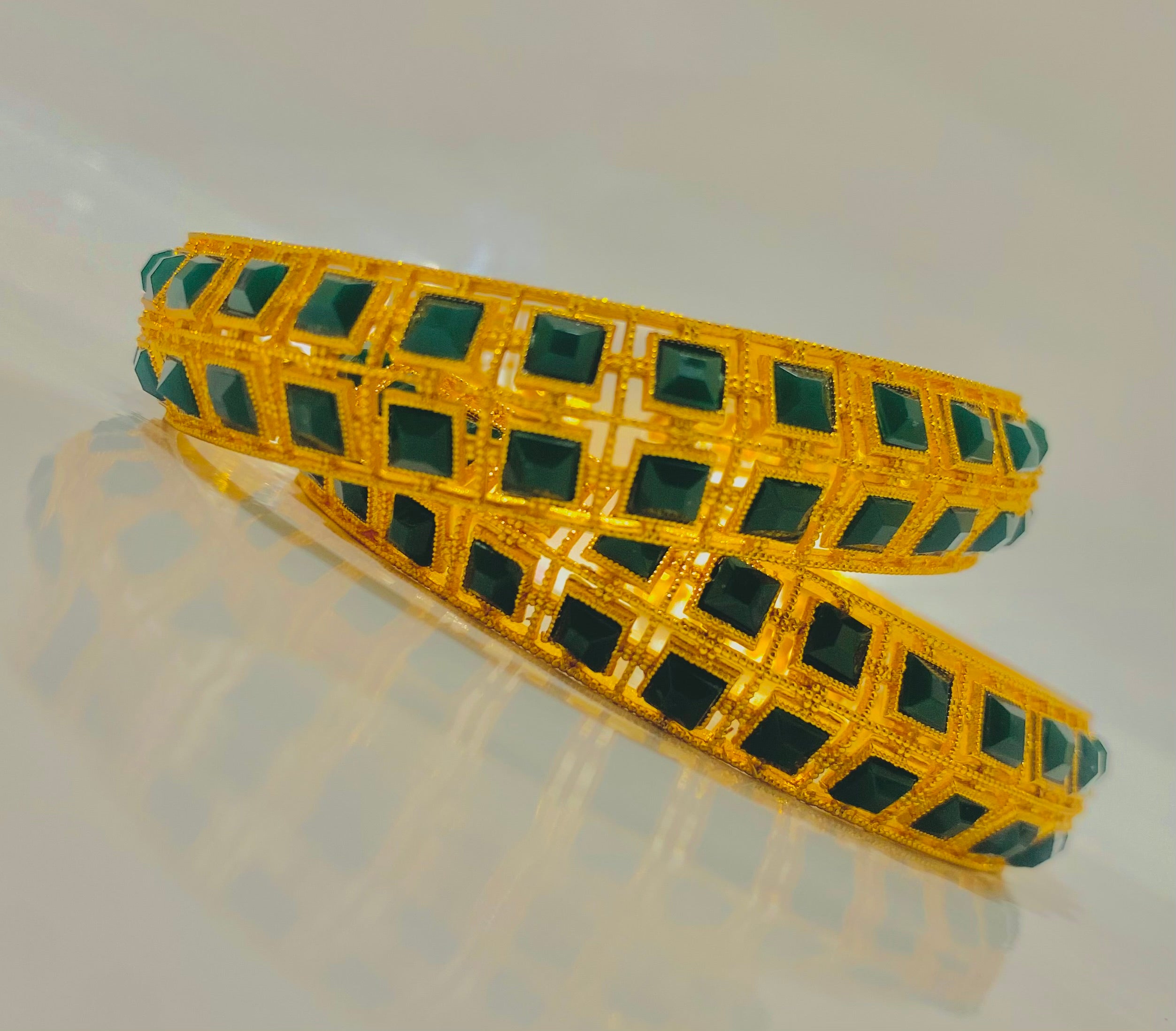 Elegant Gold-Plated Bangles with Emerald Green Stonework