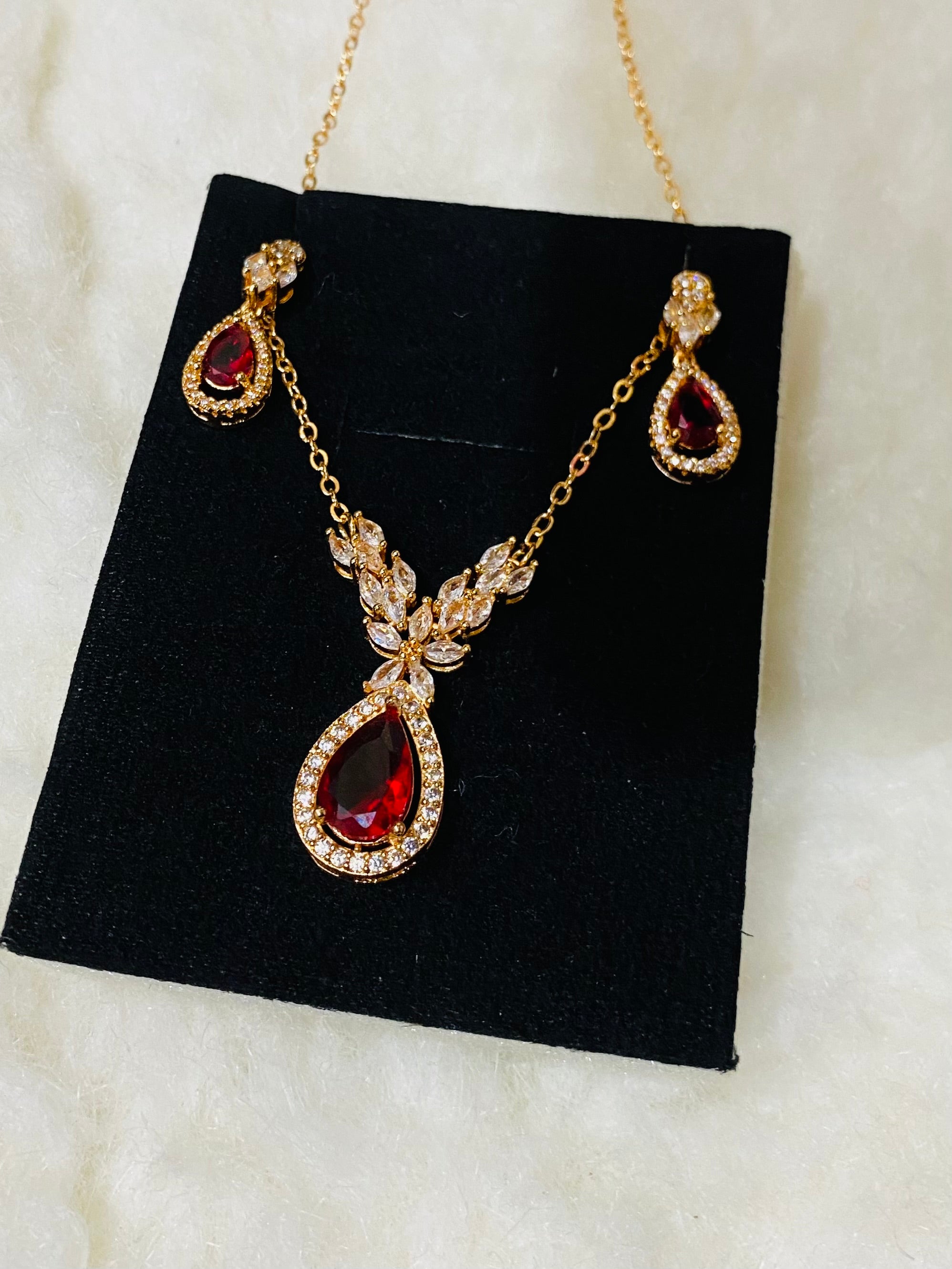 Elegant Gold-Plated Pendant Set with Ruby Red Stones