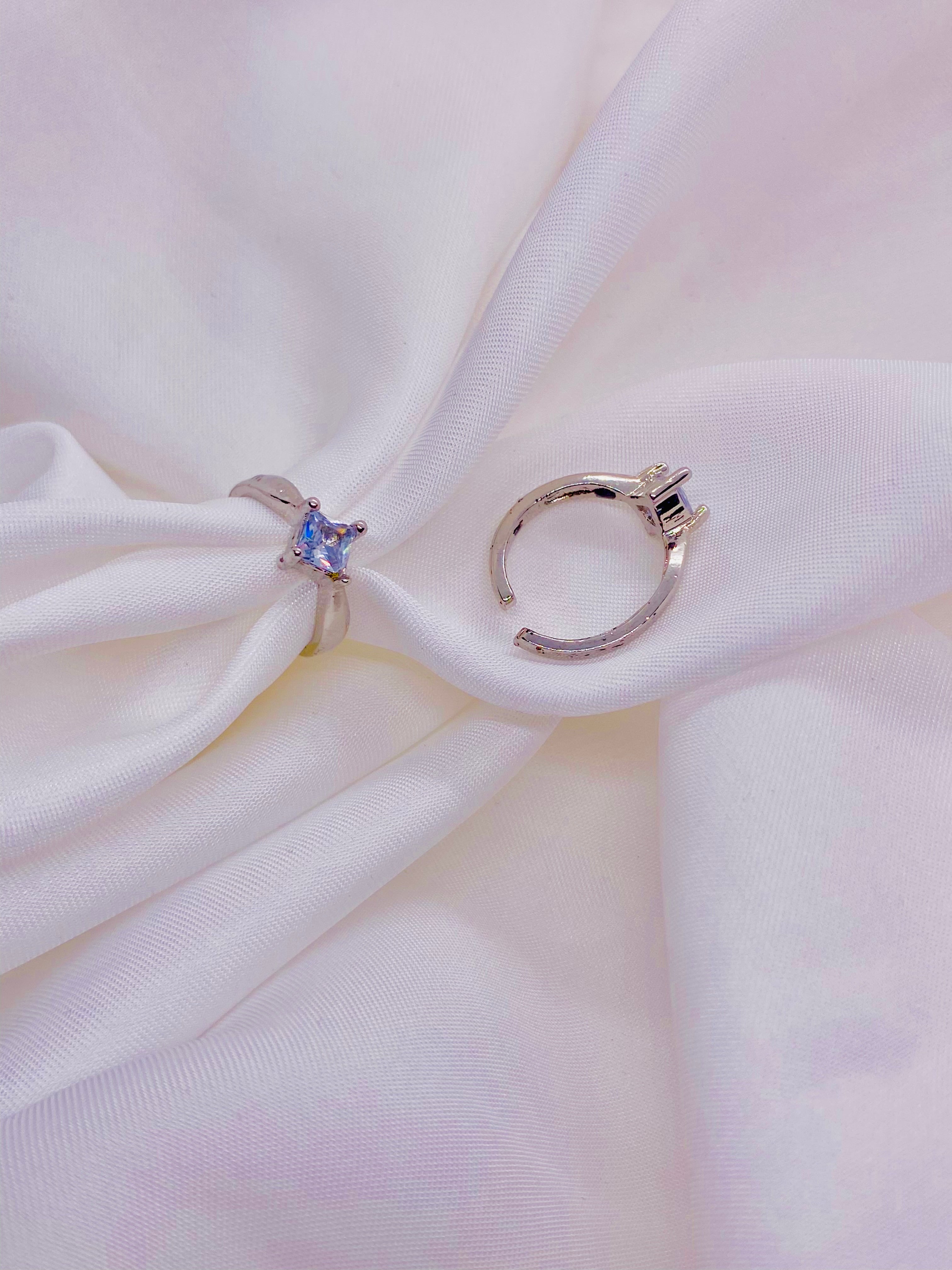 Elegant Dual-Tone Silver Adjustable Rings with Blue Center Stone