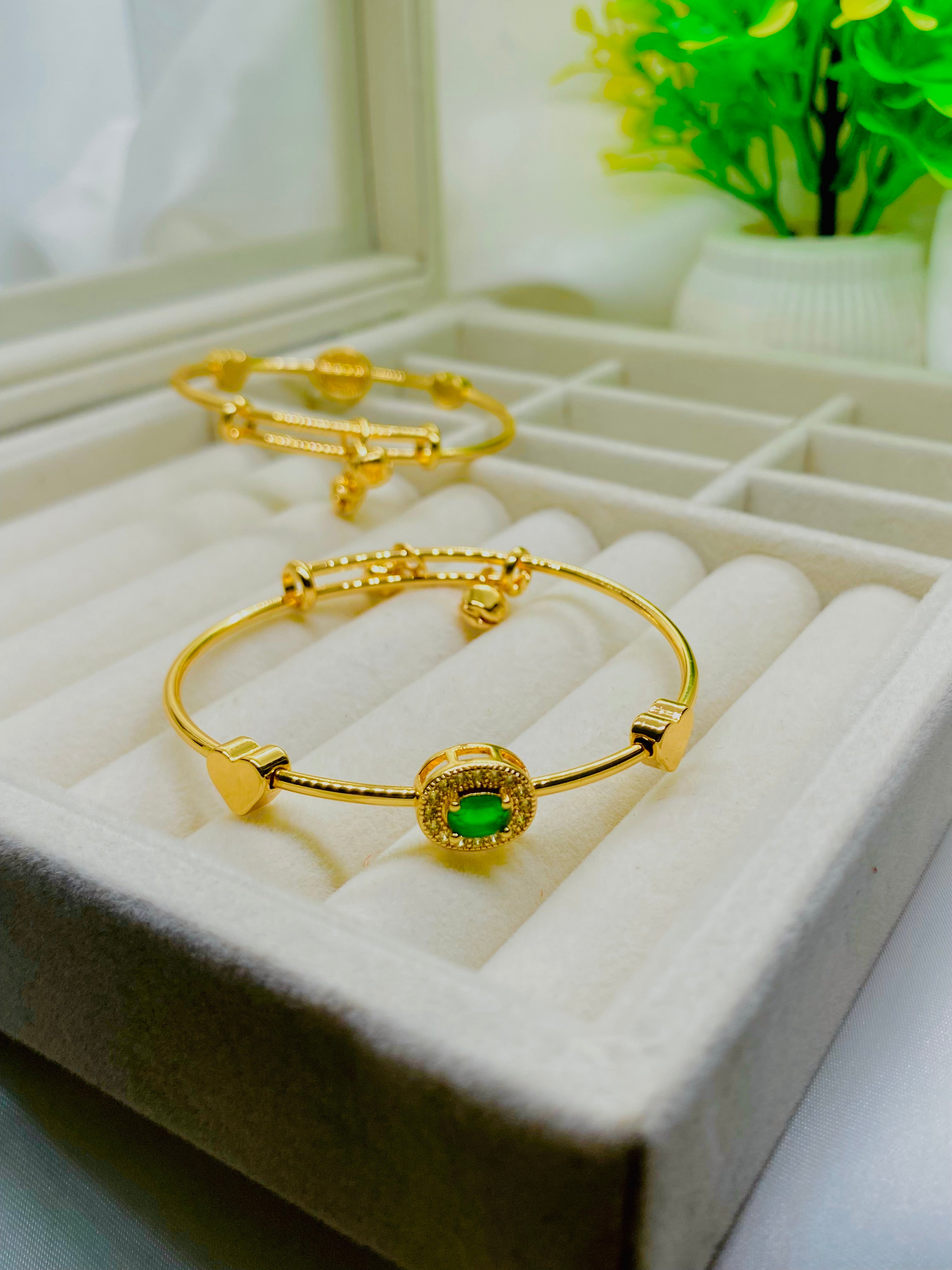 Elegant Gold-Plated Bangles with Green Stone Accent