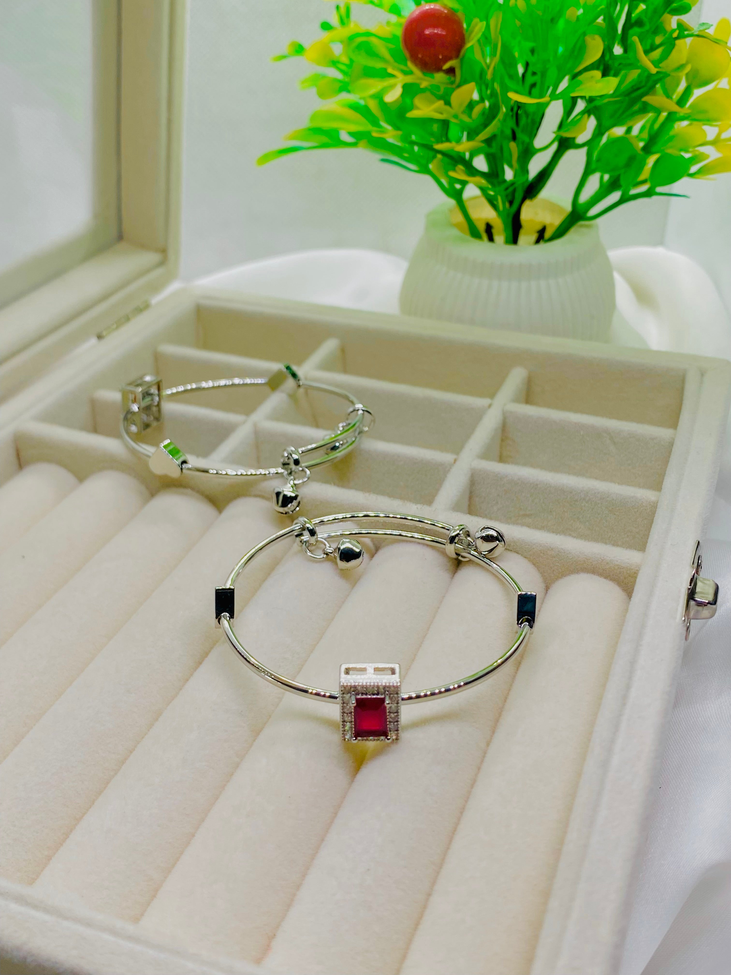 Elegant Silver Charm Bracelet with Red Stone Accent