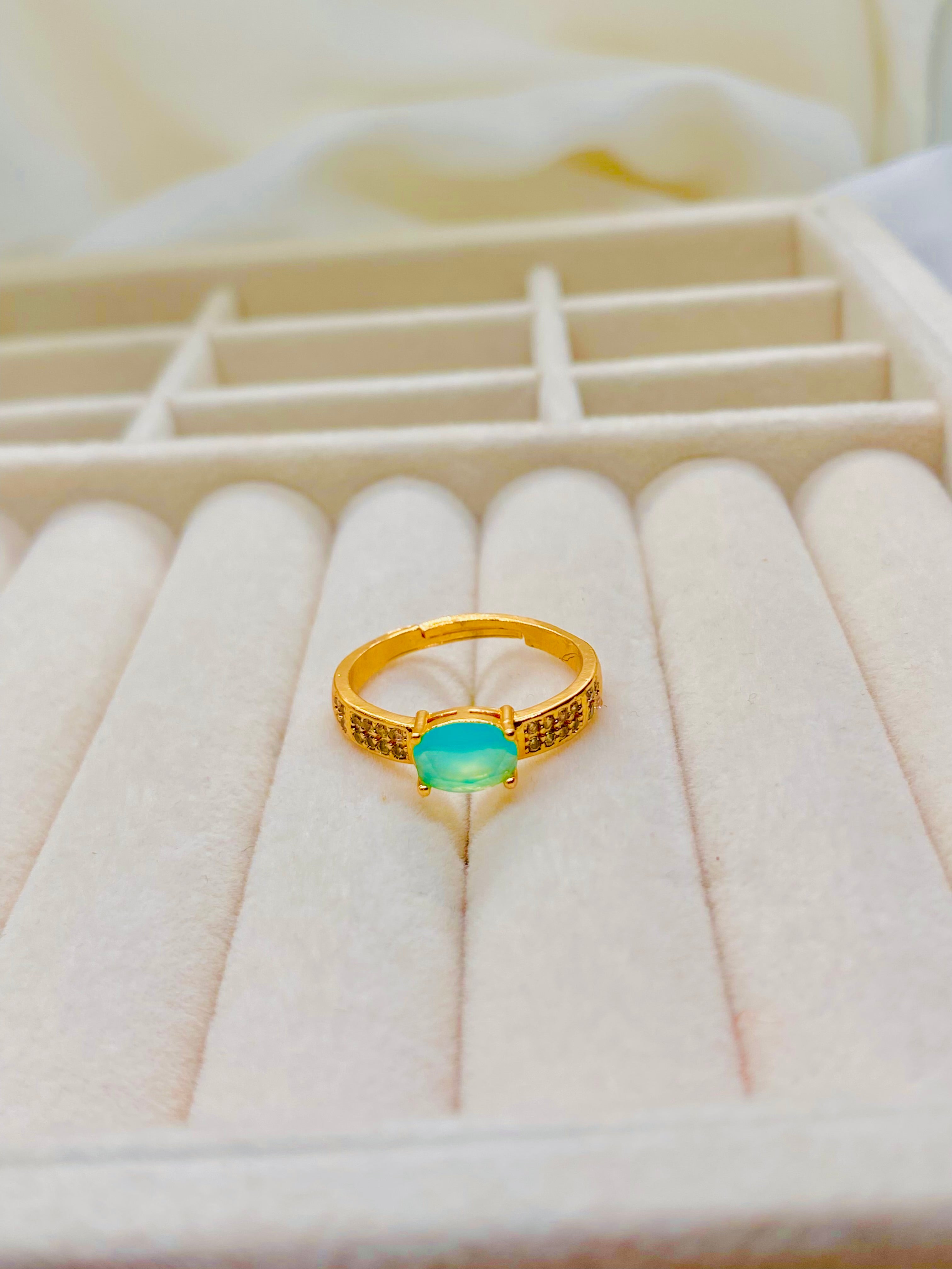 Classic Gold Solitaire Ring with Oval Turquoise Gemstone