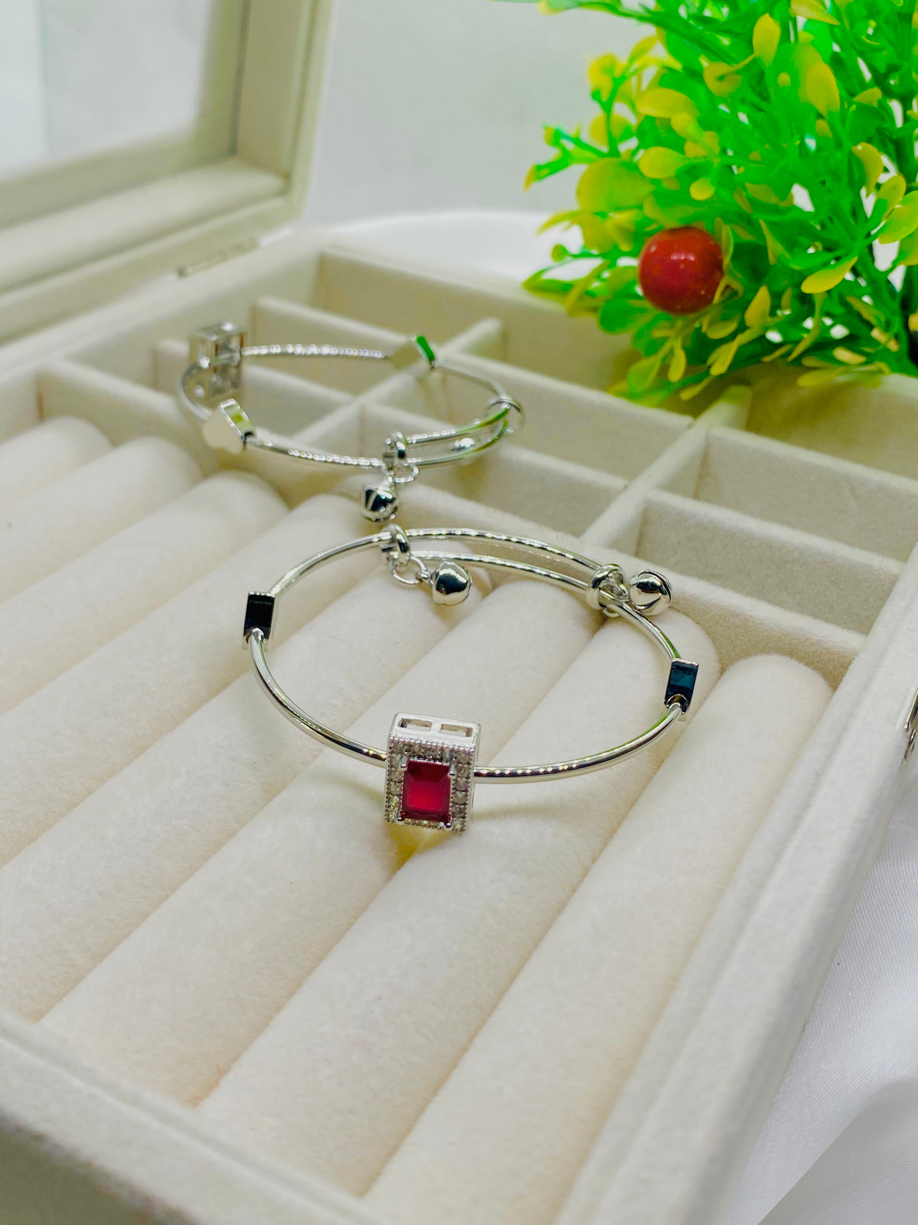 Elegant Silver Charm Bracelet with Red Stone Accent