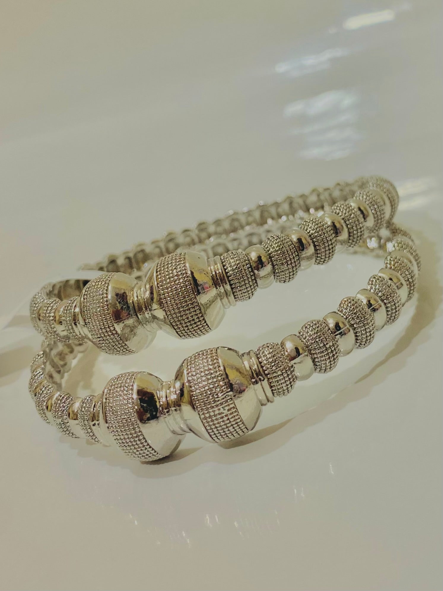 Intricately Designed Silver Bangles with Bead-Like Embellishments