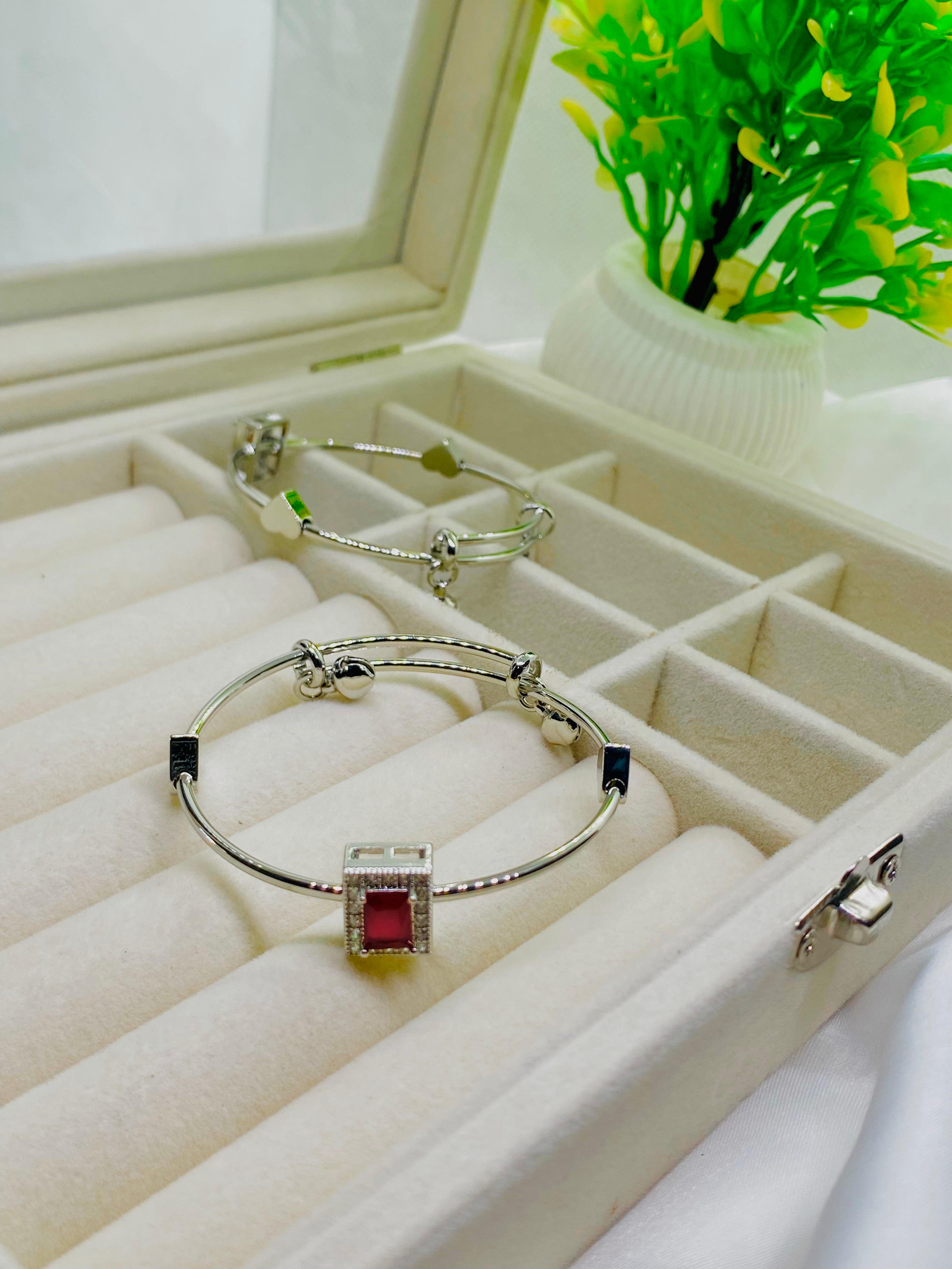 Elegant Silver Charm Bracelet with Red Stone Accent
