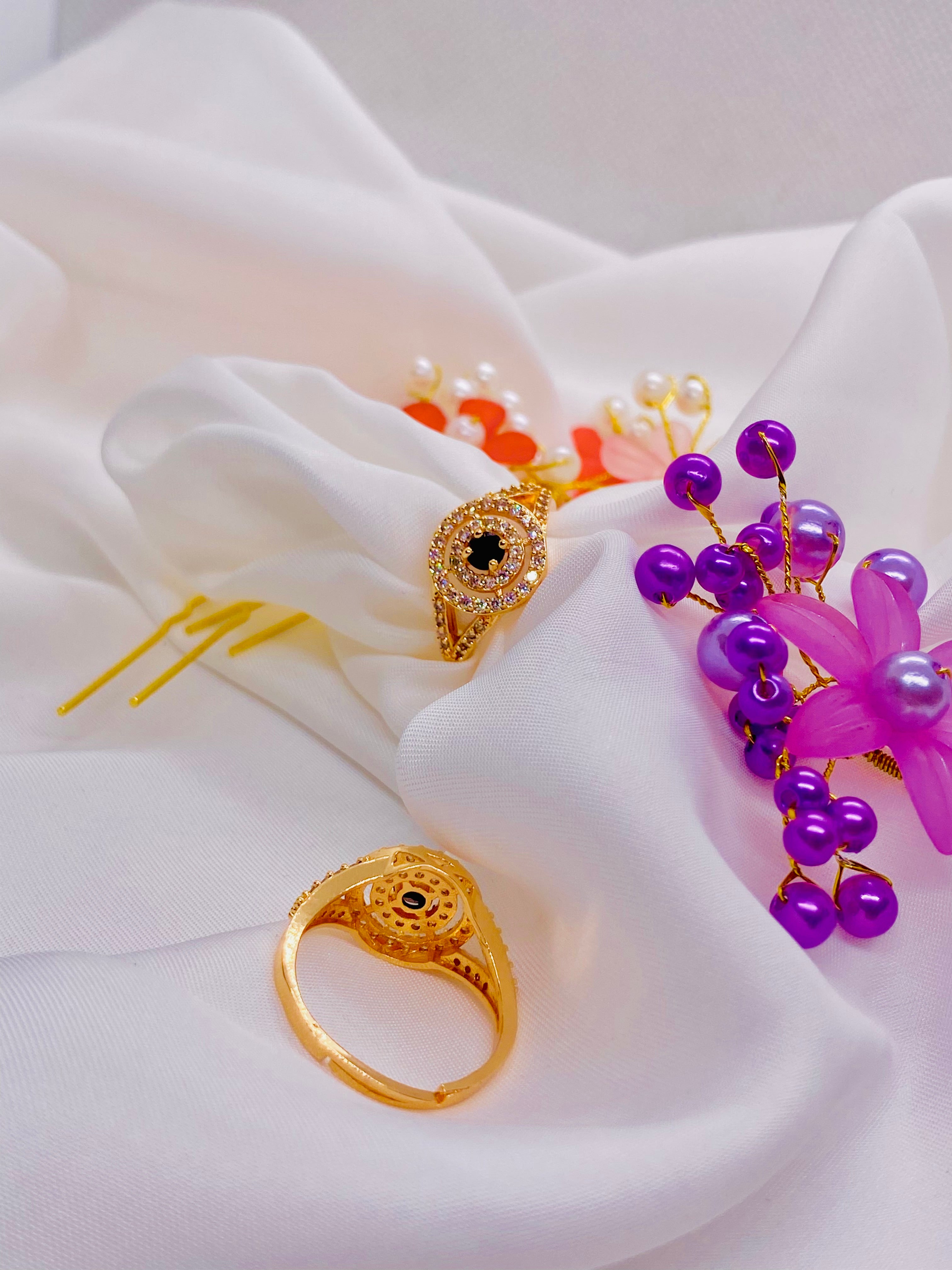 Elegant Gold Ring with Black Stone Centerpiece