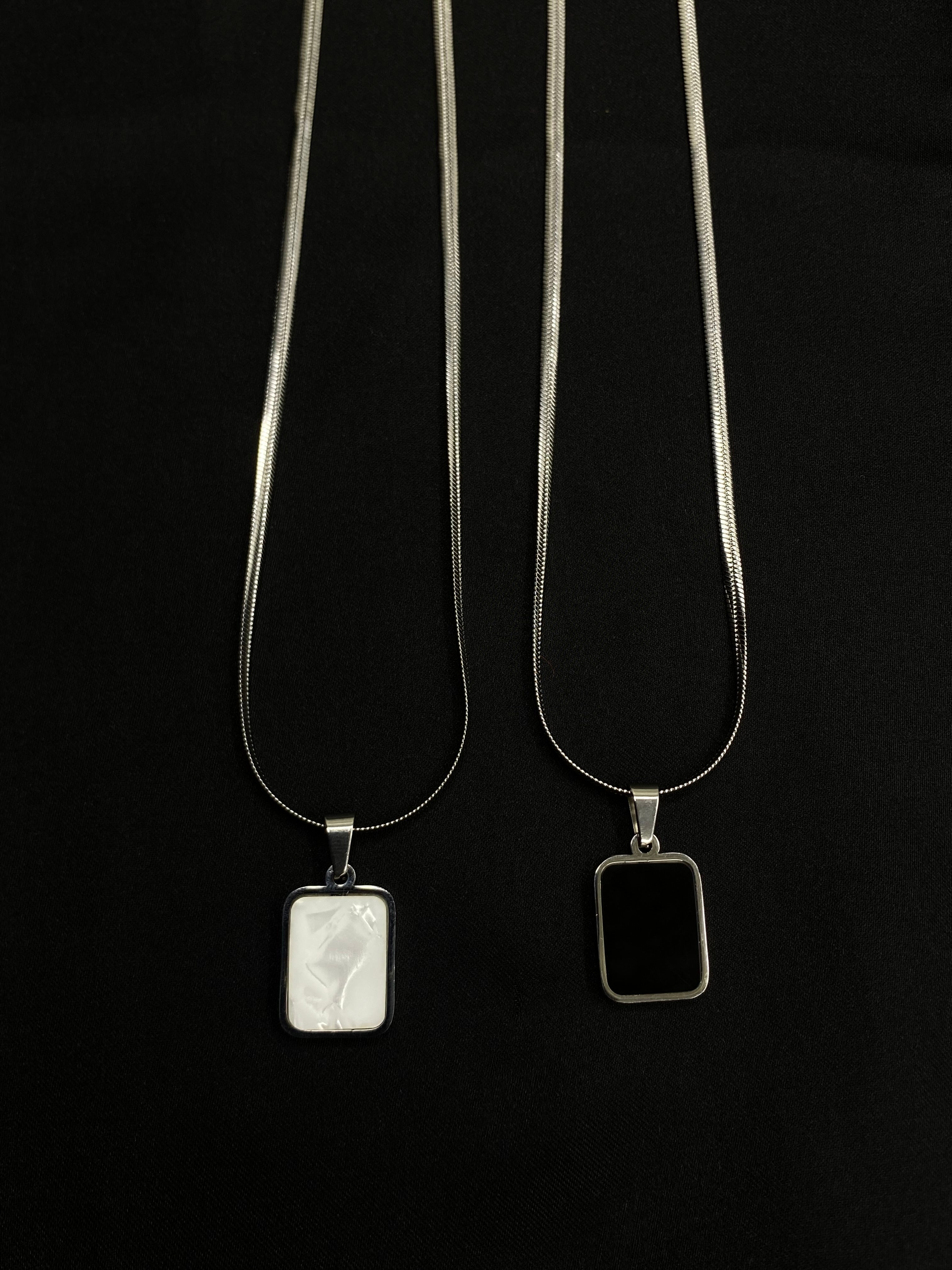 Dual-Sided Elegance: Black & White Pendant Necklace