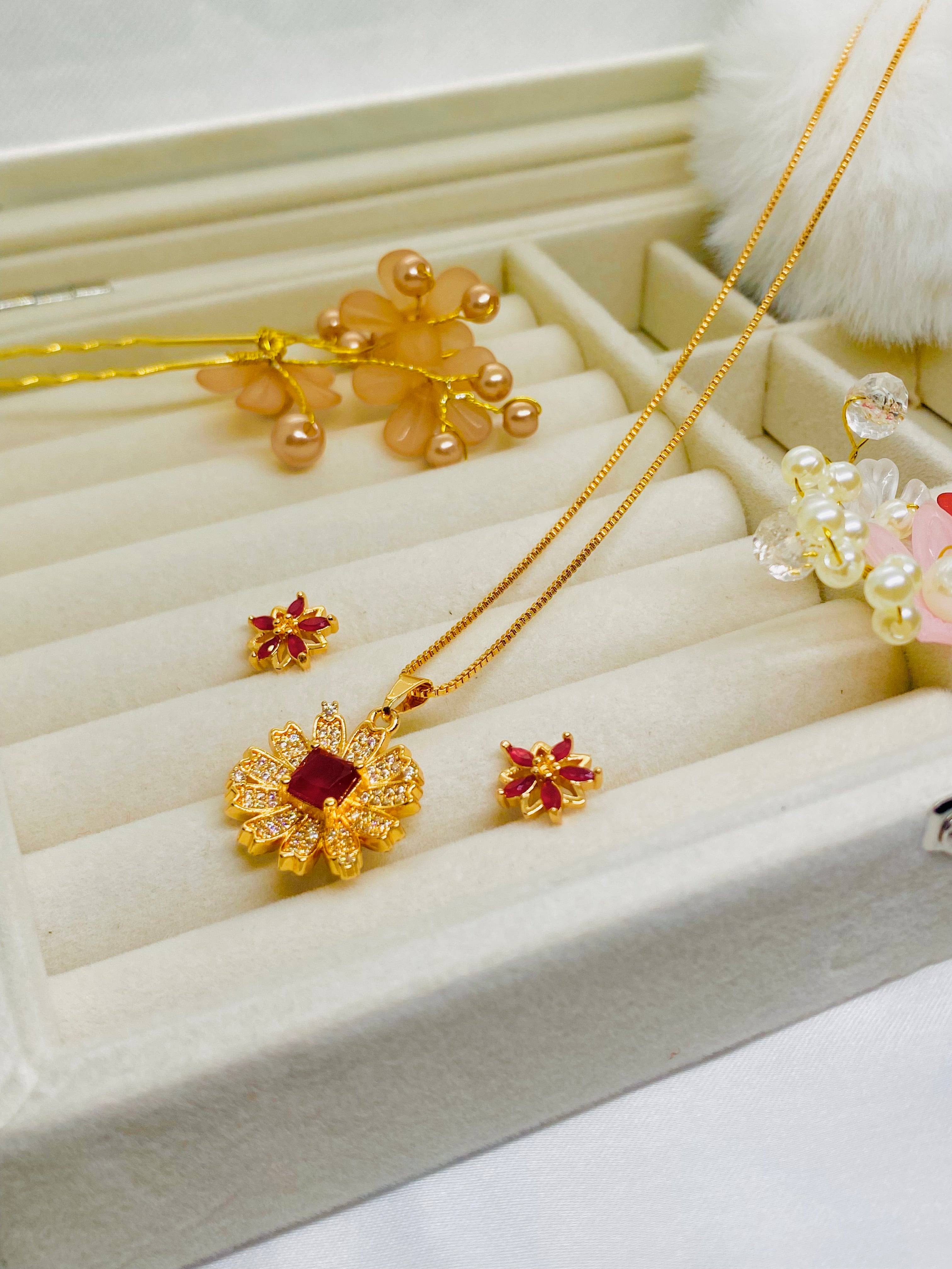 Elegant Gold-Plated Floral Pendant Set with Ruby Red Stones