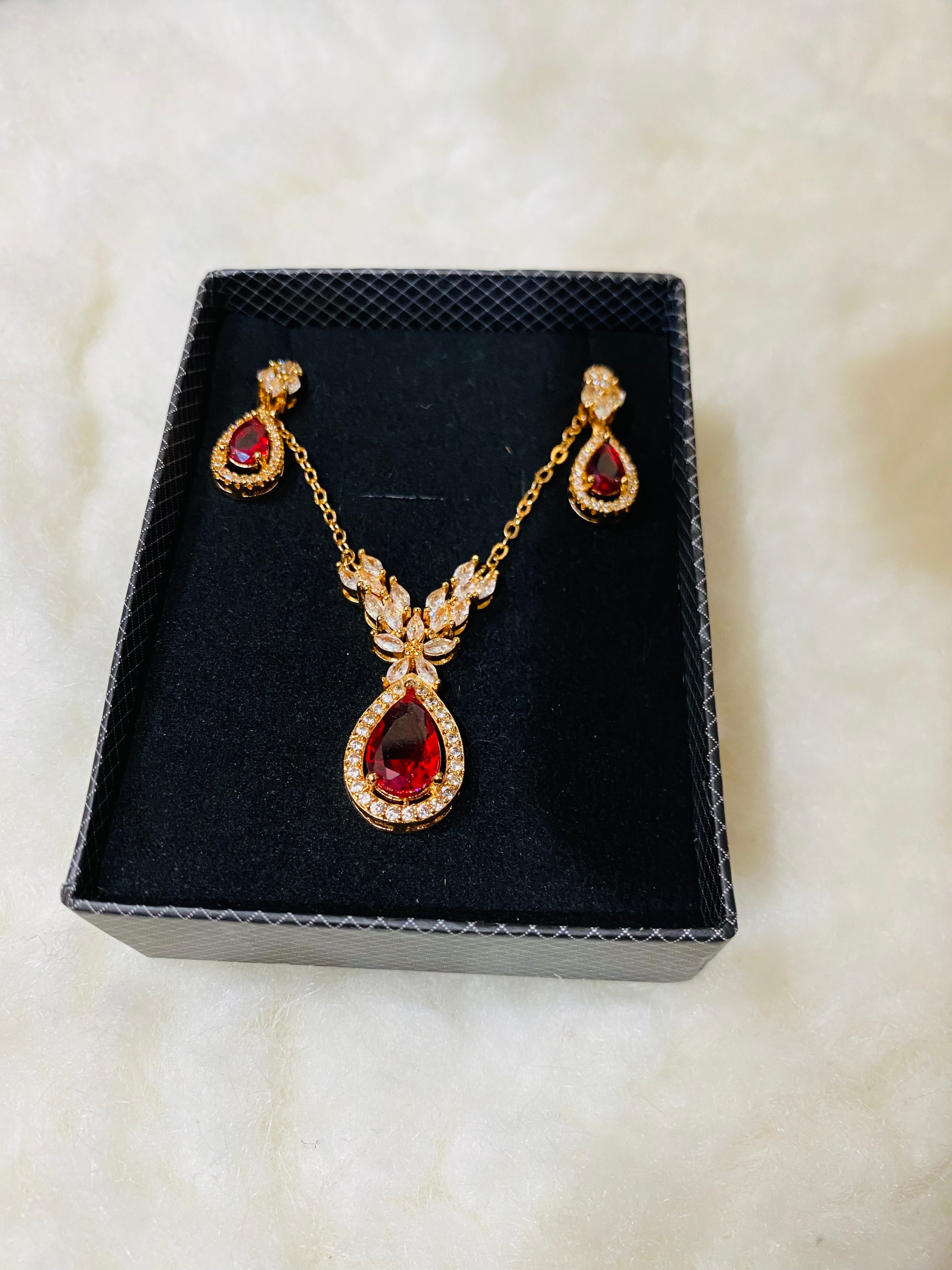 Elegant Gold-Plated Pendant Set with Ruby Red Stones