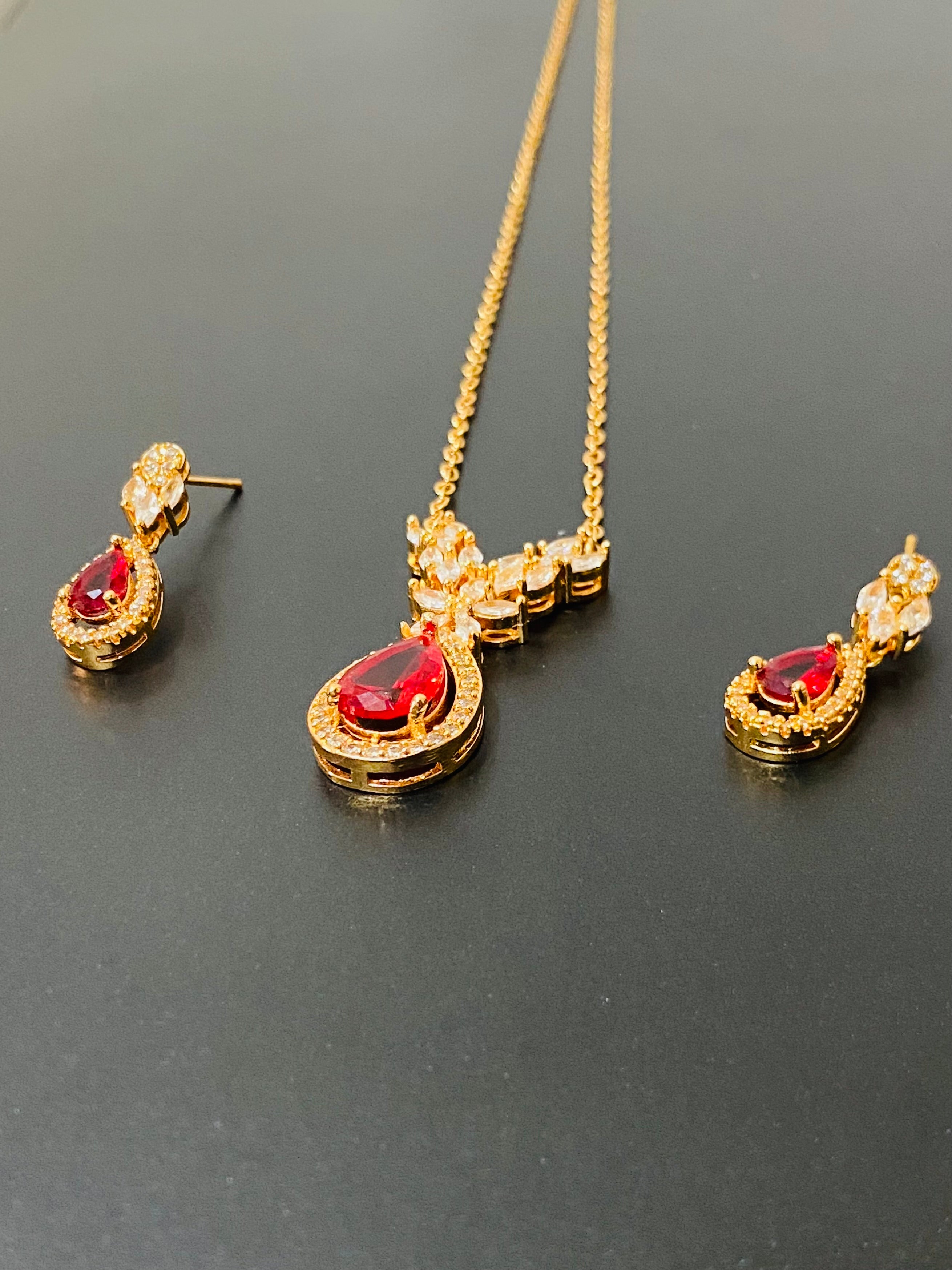 Elegant Gold-Plated Pendant Set with Ruby Red Stones