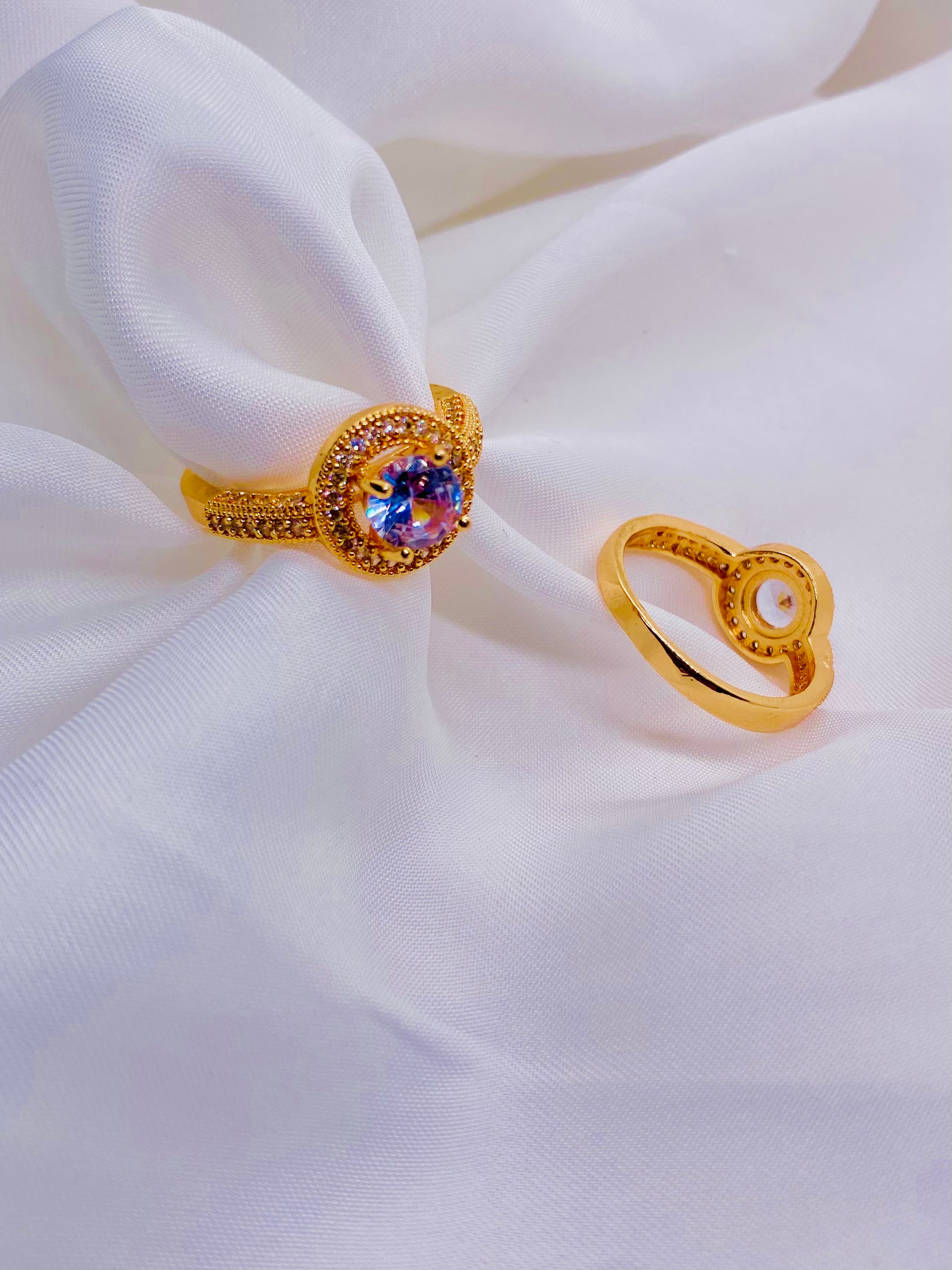 Vintage-Inspired Gold Rings with Iridescent Center Stones