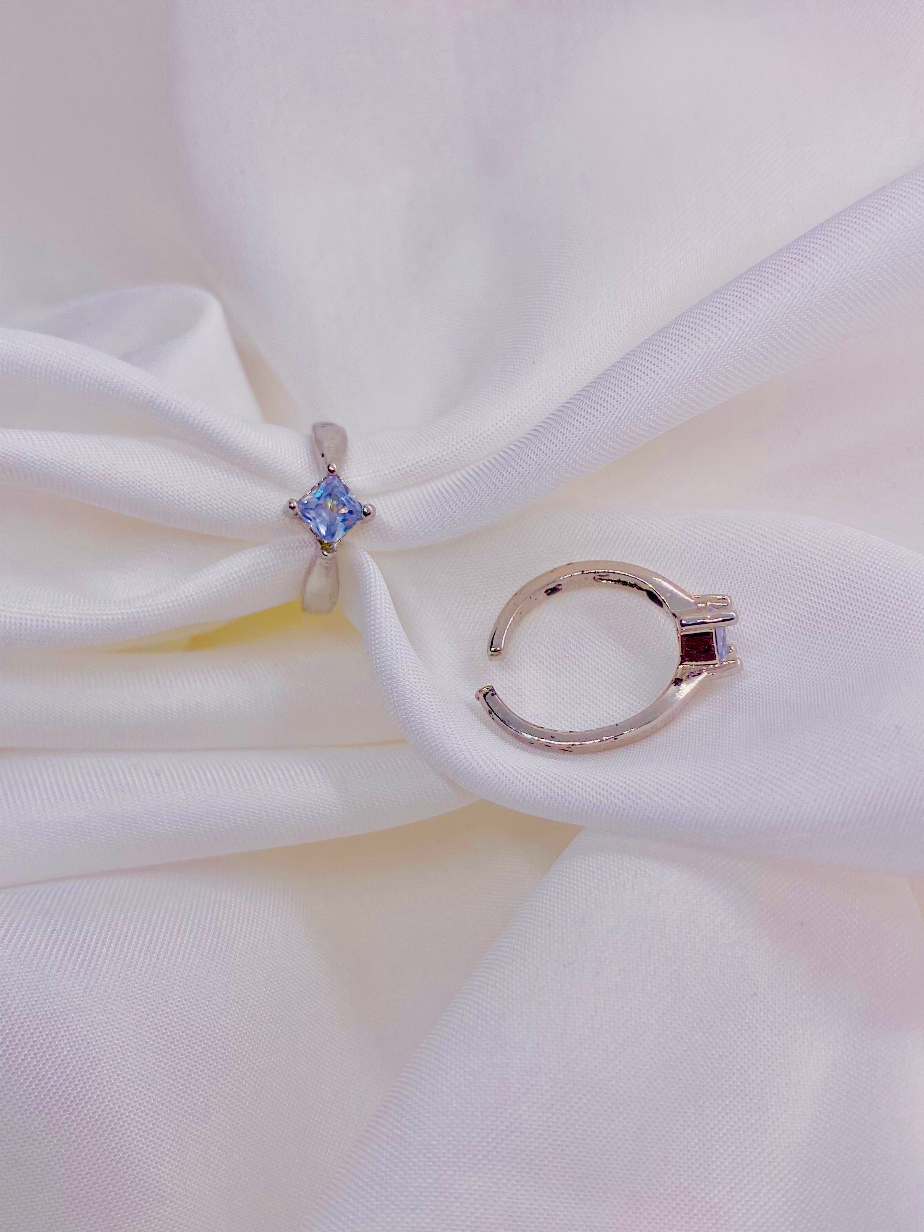 Elegant Dual-Tone Silver Adjustable Rings with Blue Center Stone
