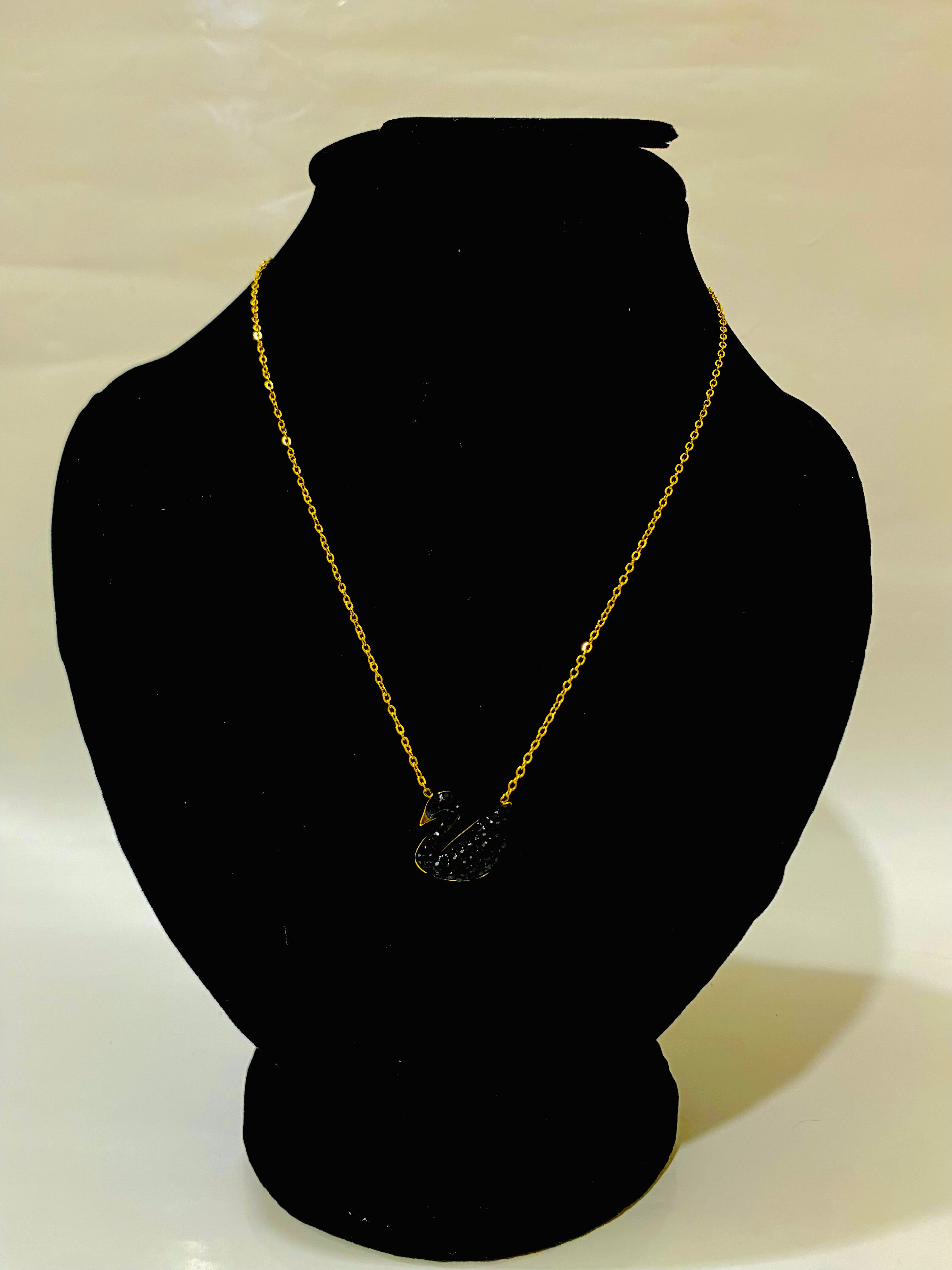 Sleek Gold and Black Duck Pendant Necklace