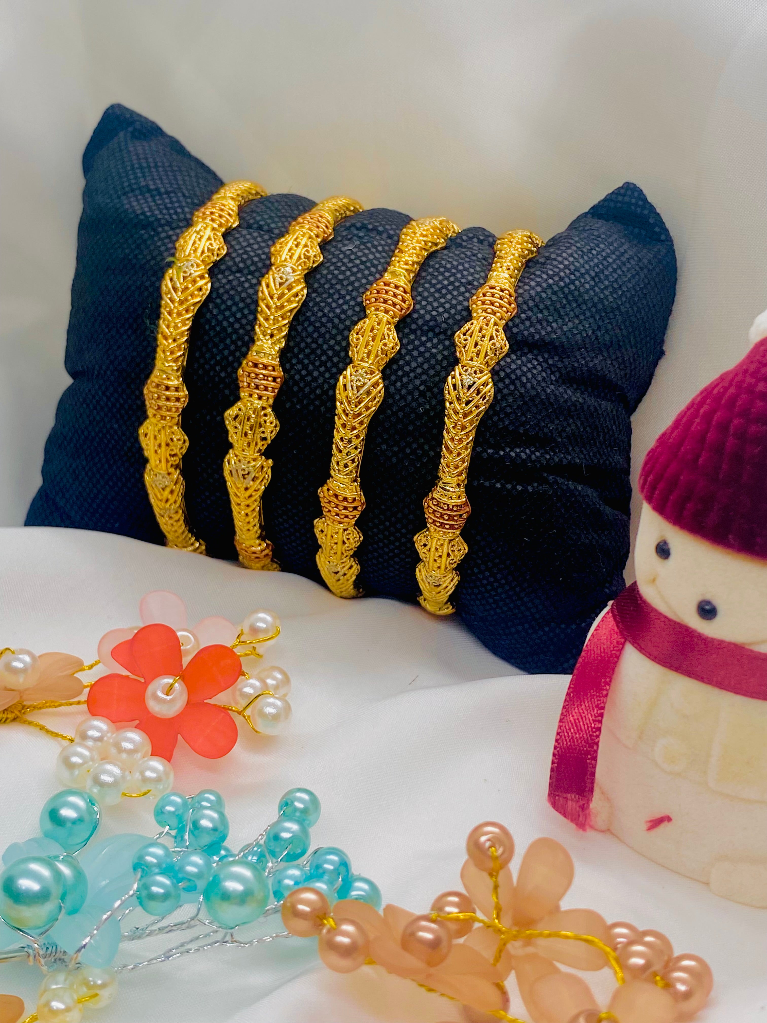 Set of Four Antique-Finish Gold Bangles with Intricate Detailing