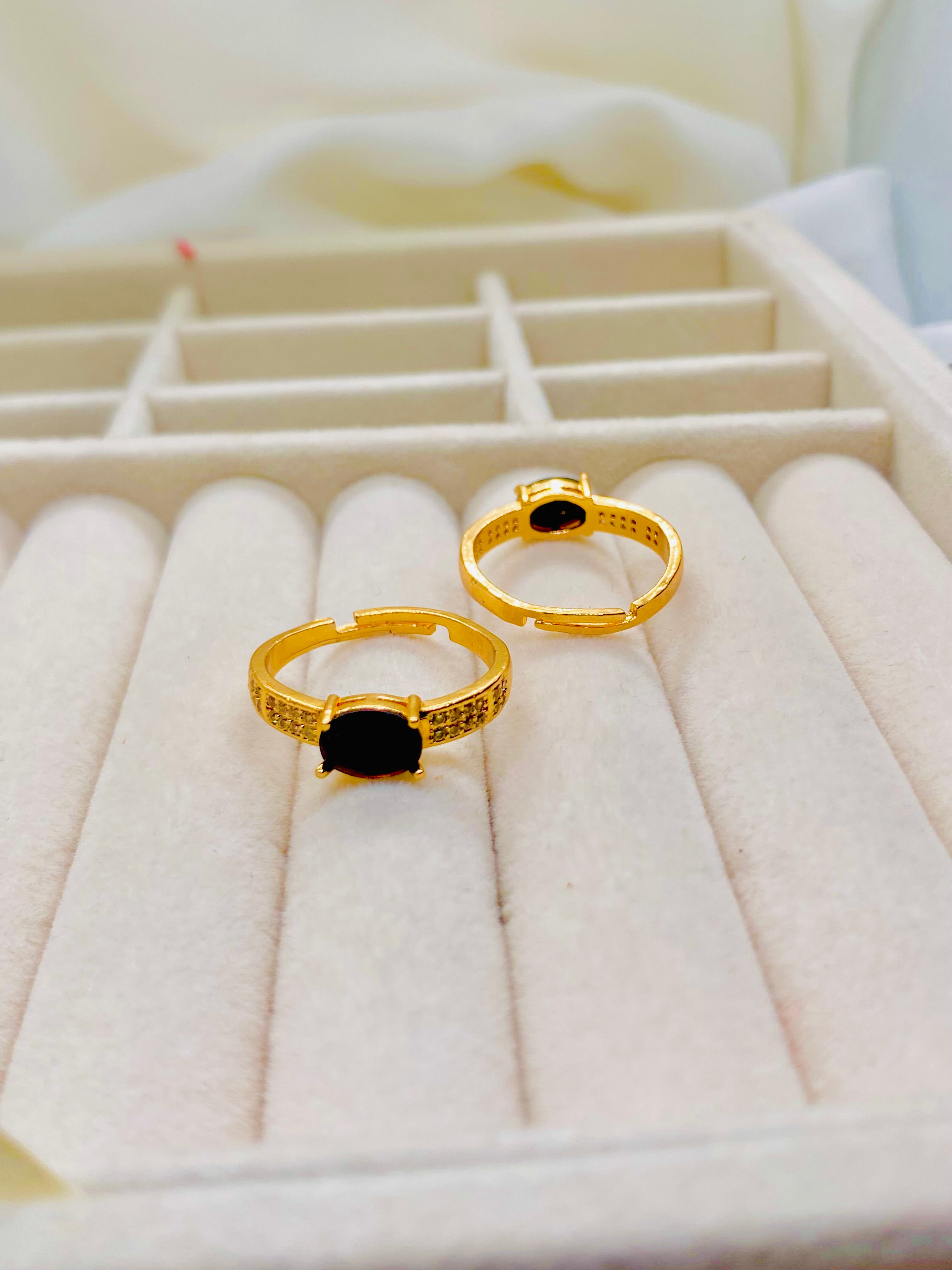 Elegant Gold-Plated Rings with Black Onyx Centerpiece