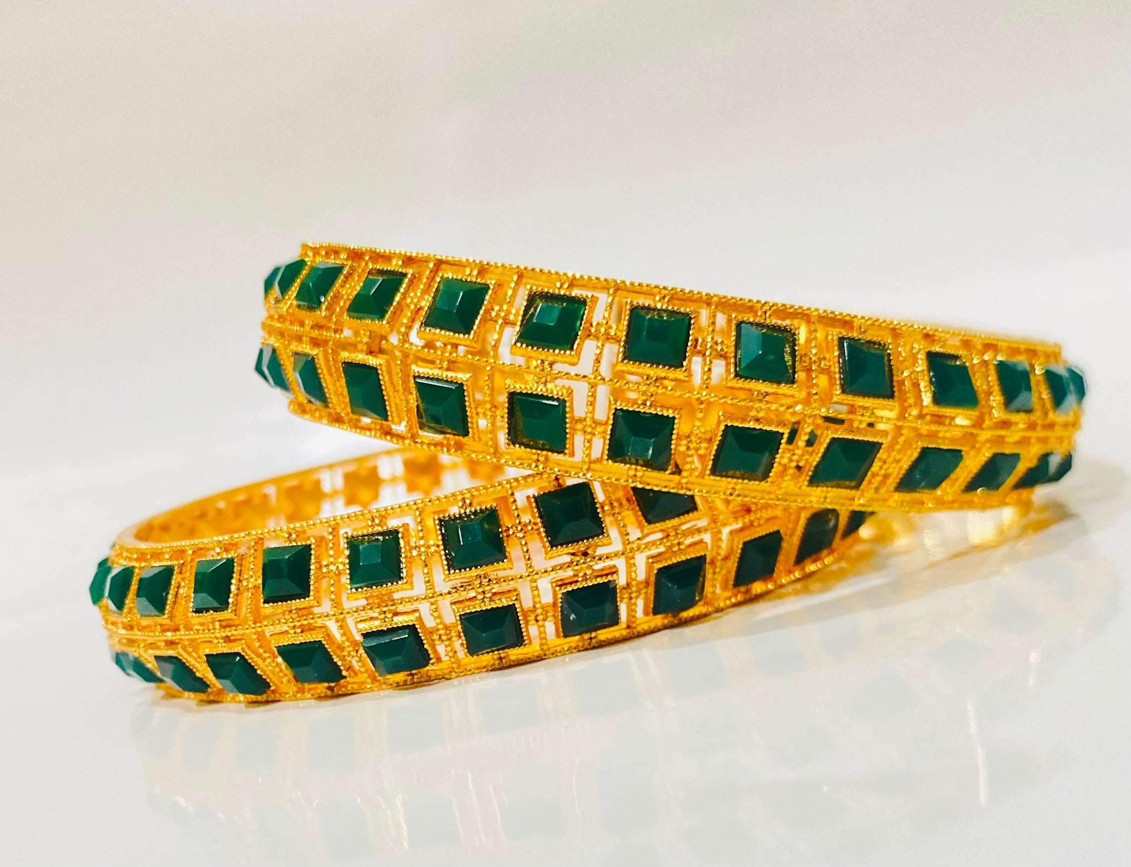Elegant Gold-Plated Bangles with Emerald Green Stonework