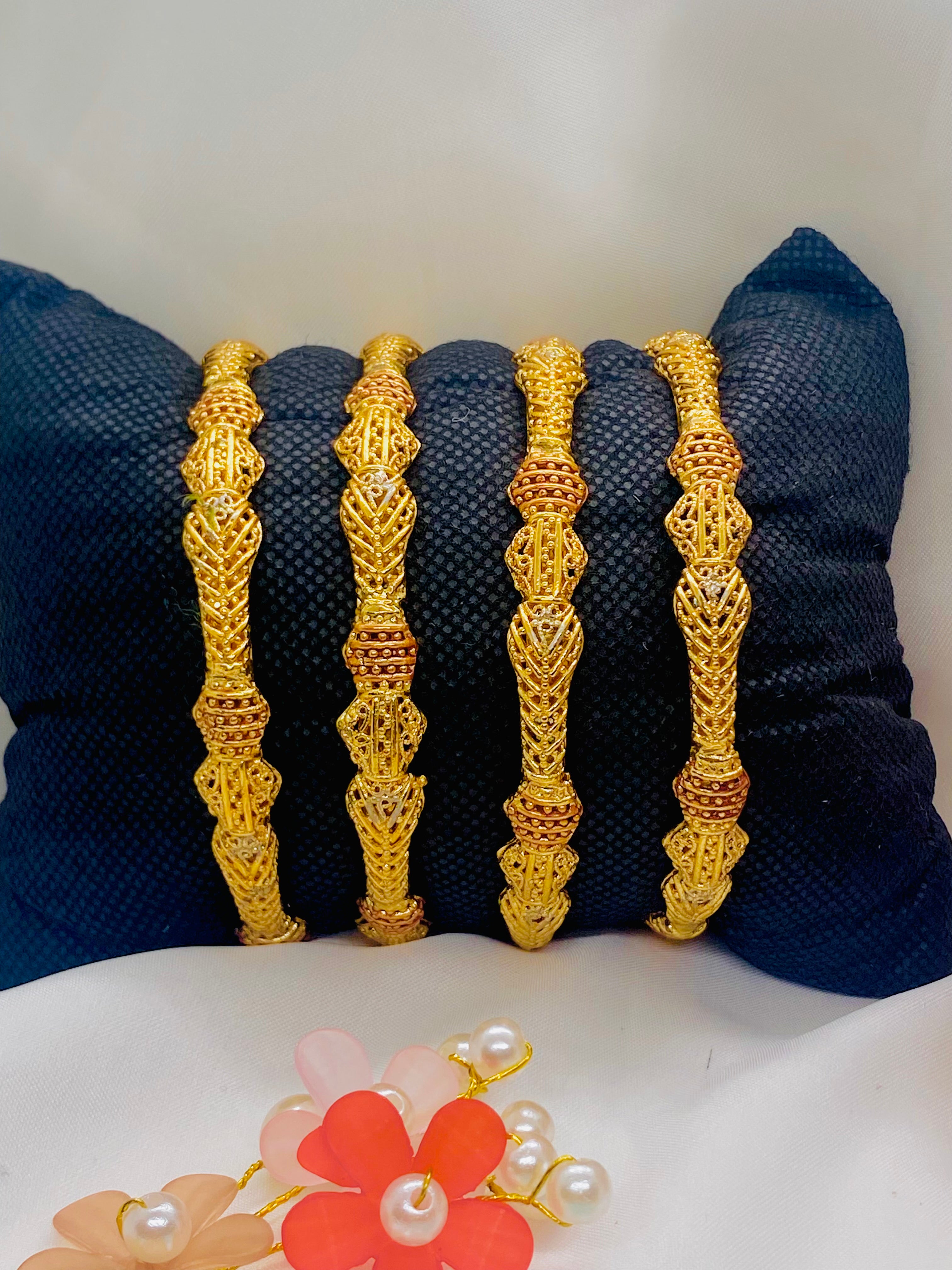 Set of Four Antique-Finish Gold Bangles with Intricate Detailing