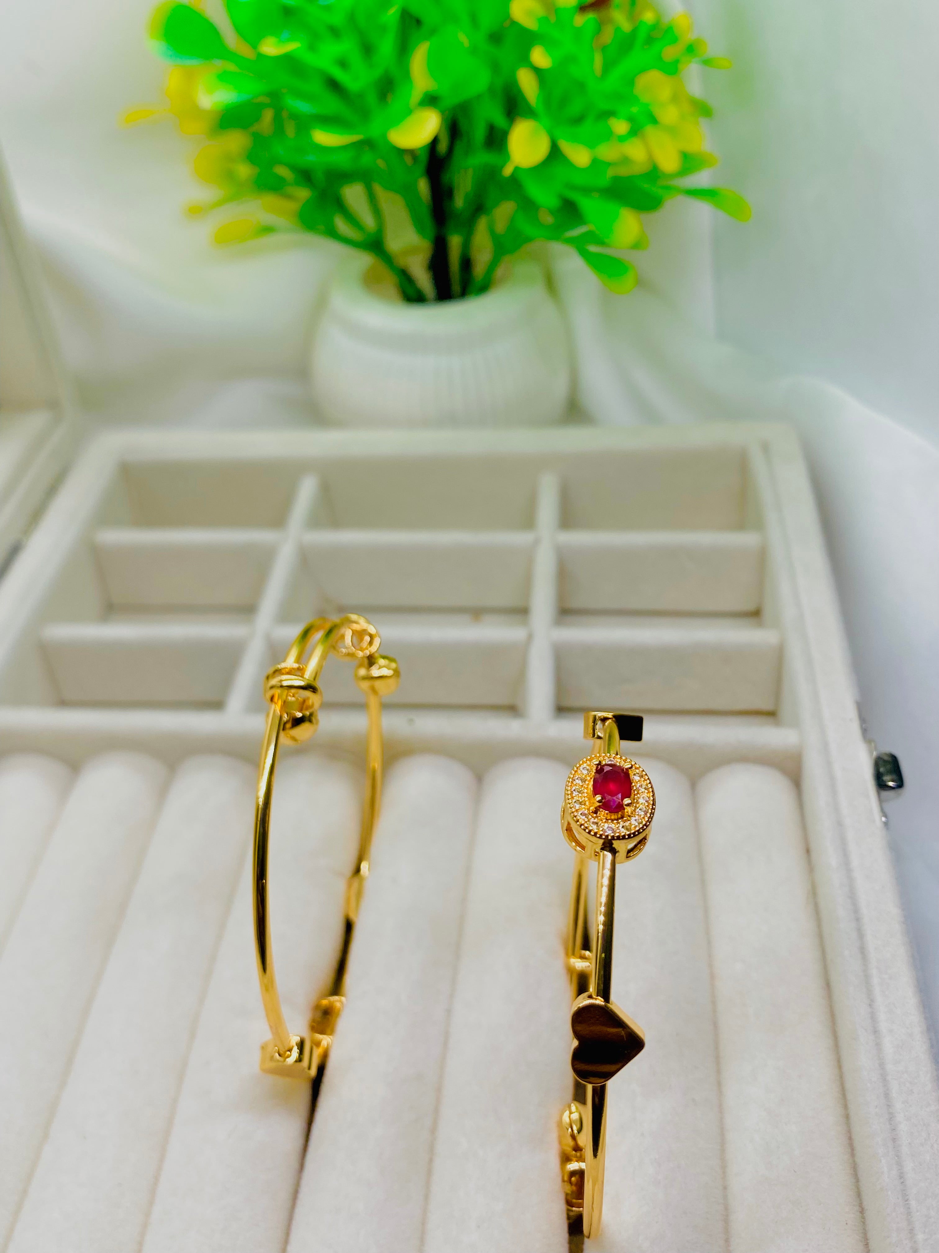 Elegant Gold Bangles with Ruby Accent and Heart Charm