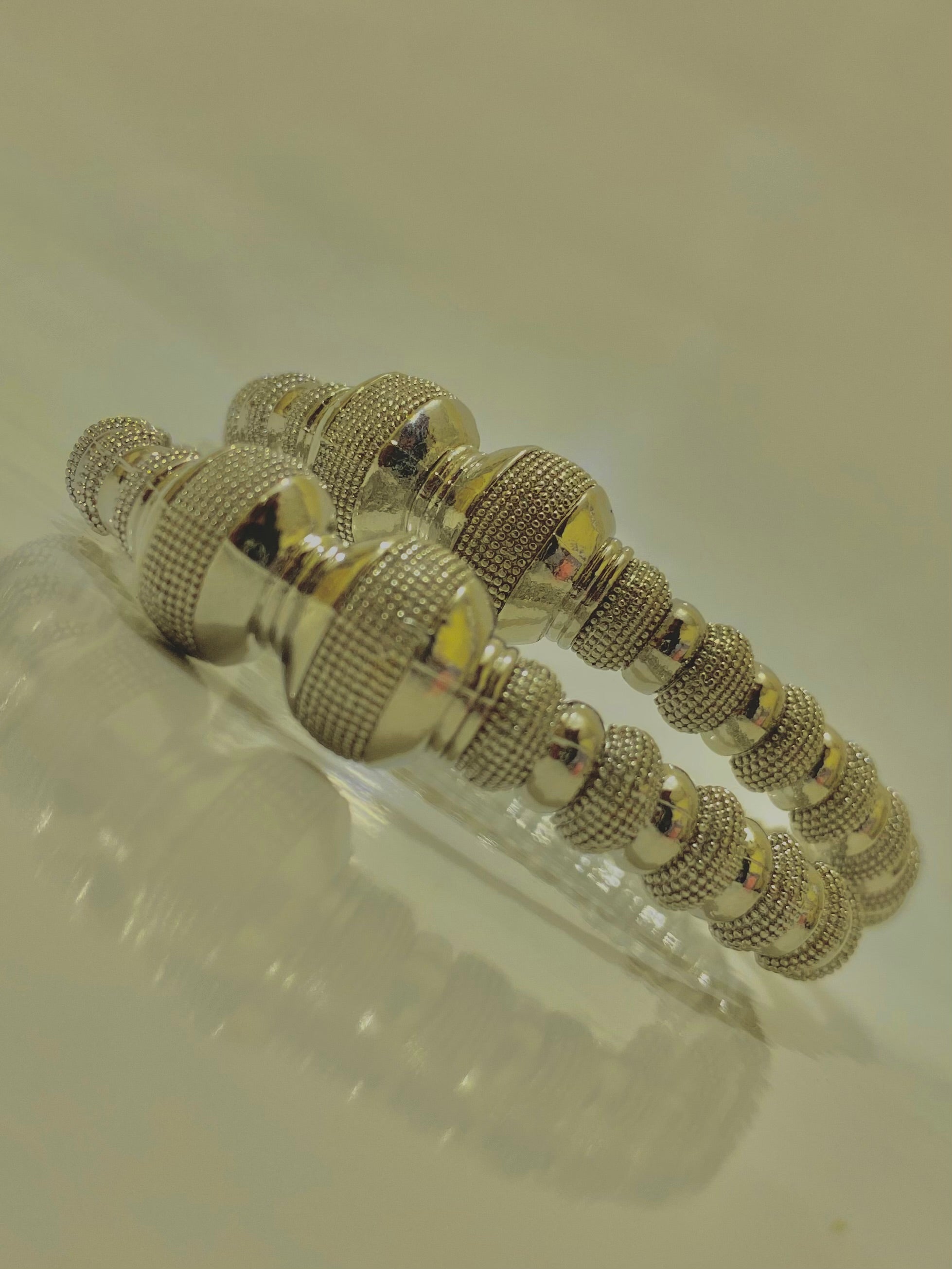 Intricately Designed Silver Bangles with Bead-Like Embellishments